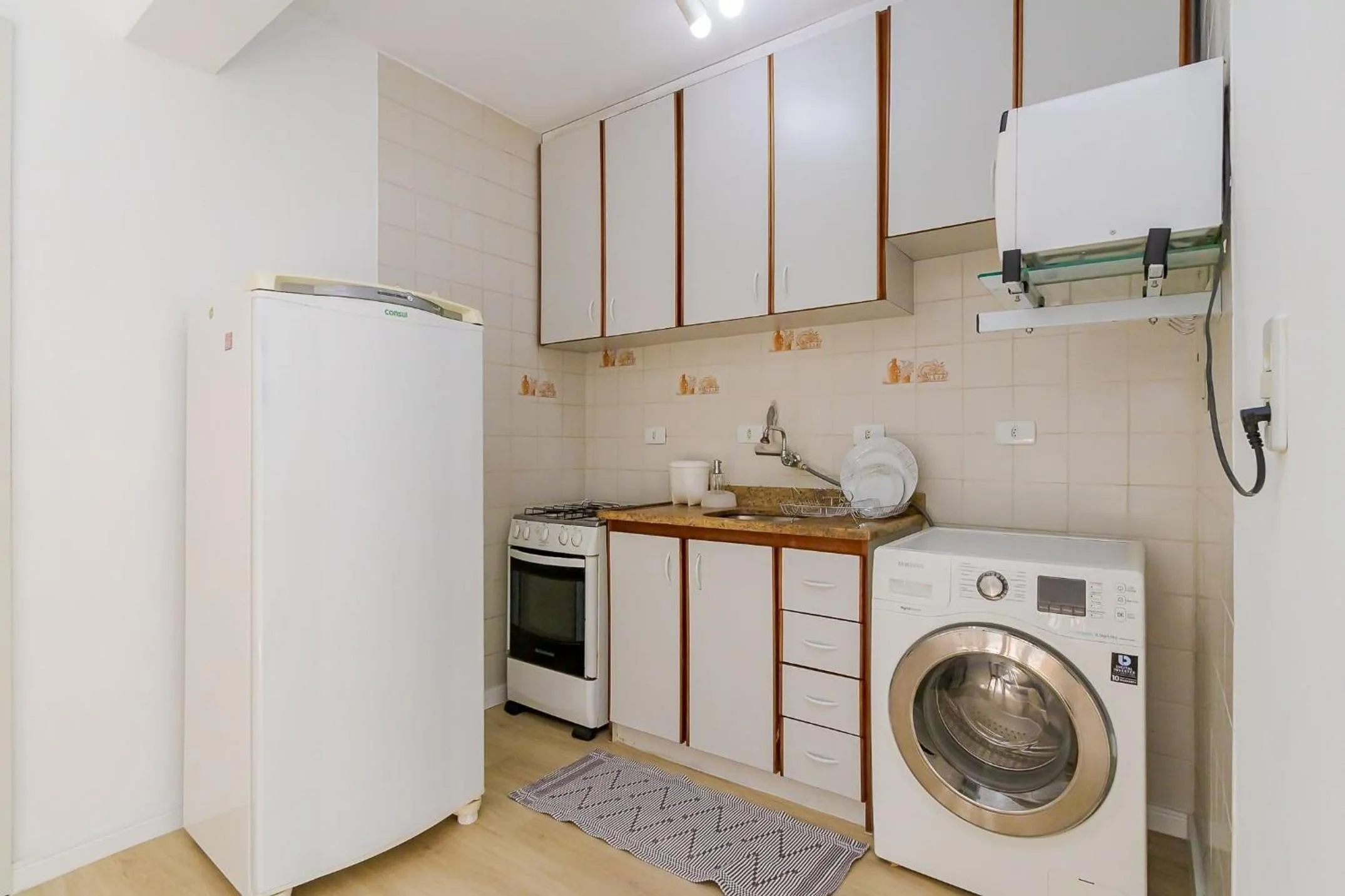 Kitchen or kitchenette in Ed. Vitoria | Bairro mais requisitado de Curitiba | Gonzaga Stays