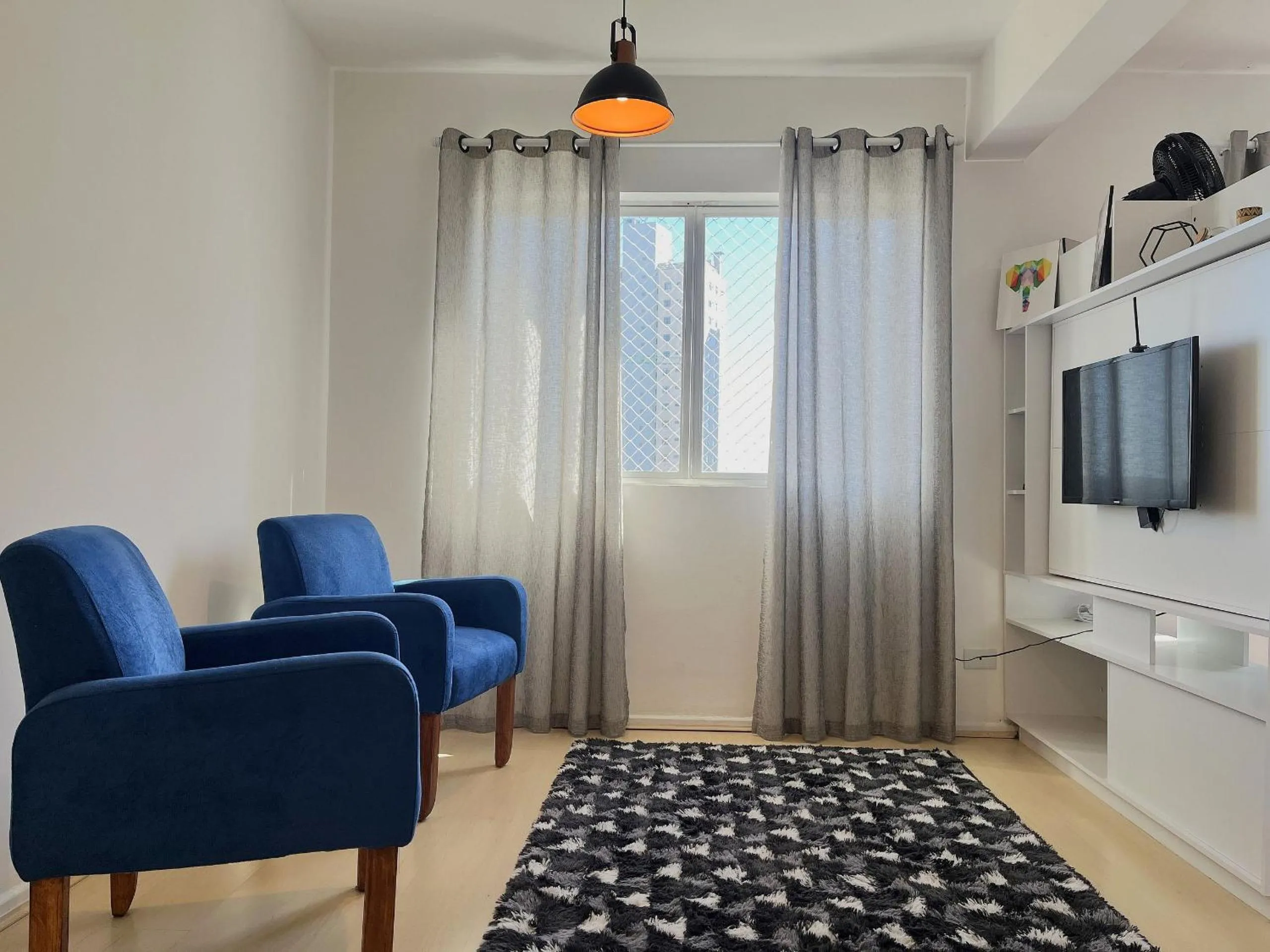 Living room in Ed. Vitoria | Bairro mais requisitado de Curitiba | Gonzaga Stays