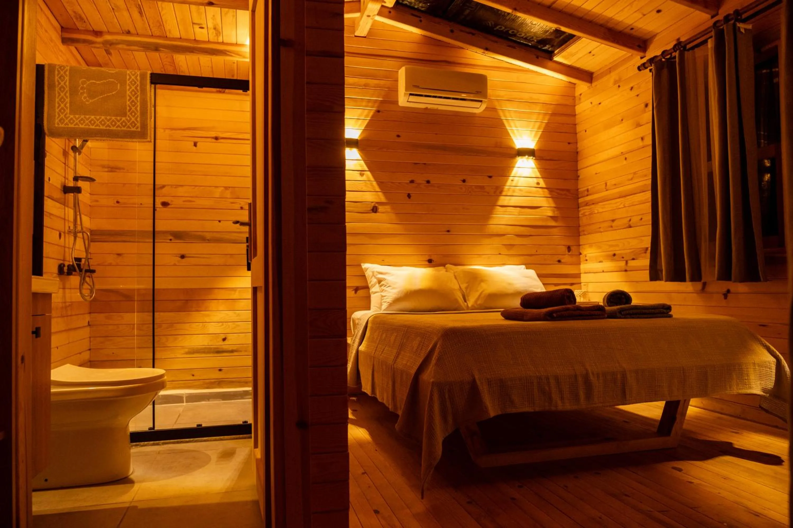 Bed in Goat Bungalow and Camping