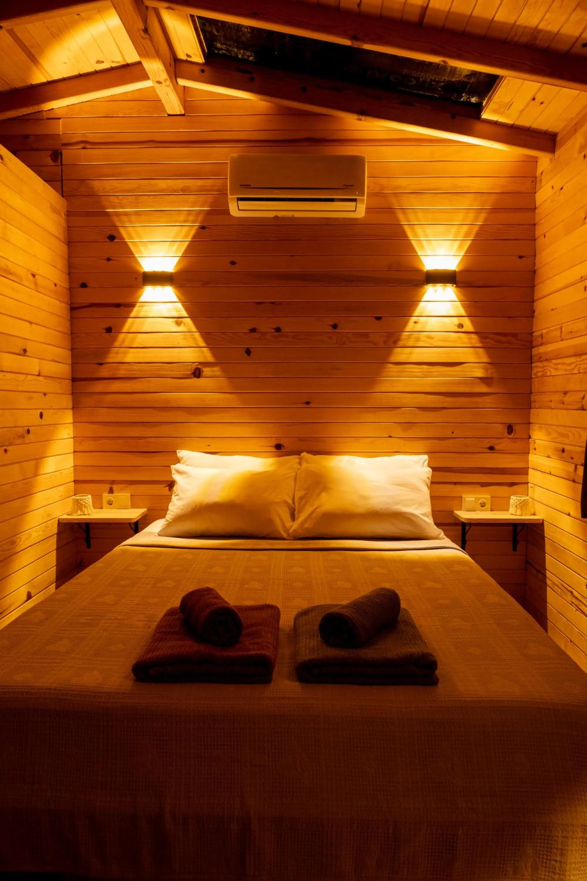 Bed in Goat Bungalow and Camping