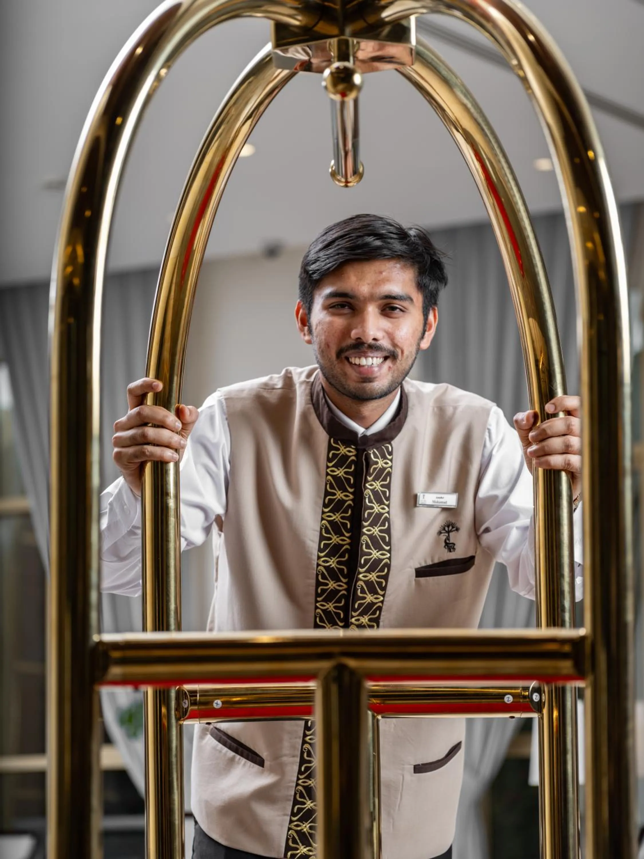 concierge in Wirgan Al Noor, Tapestry Collection by Hilton