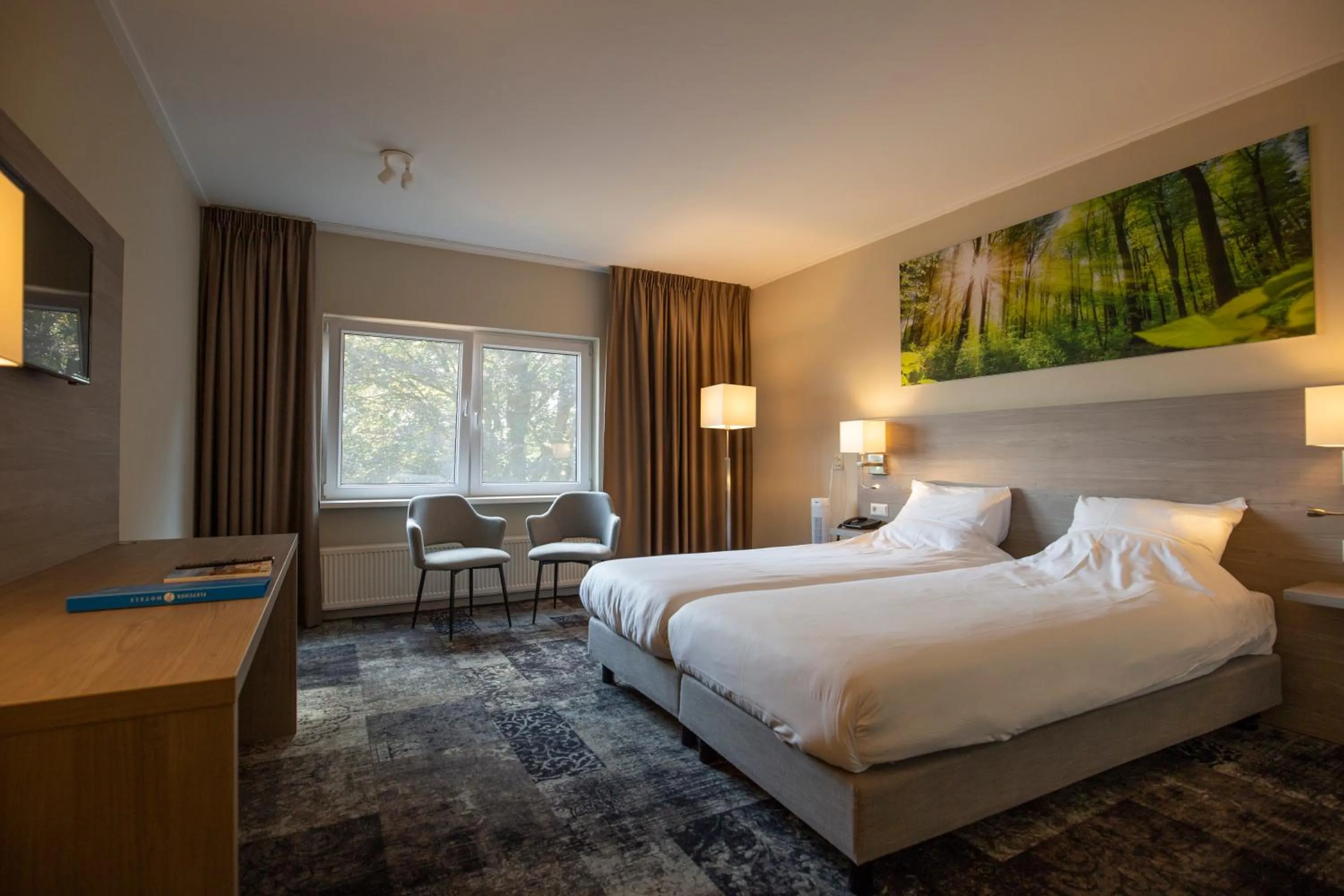 Bed in Fletcher Hotel Restaurant Paasberg