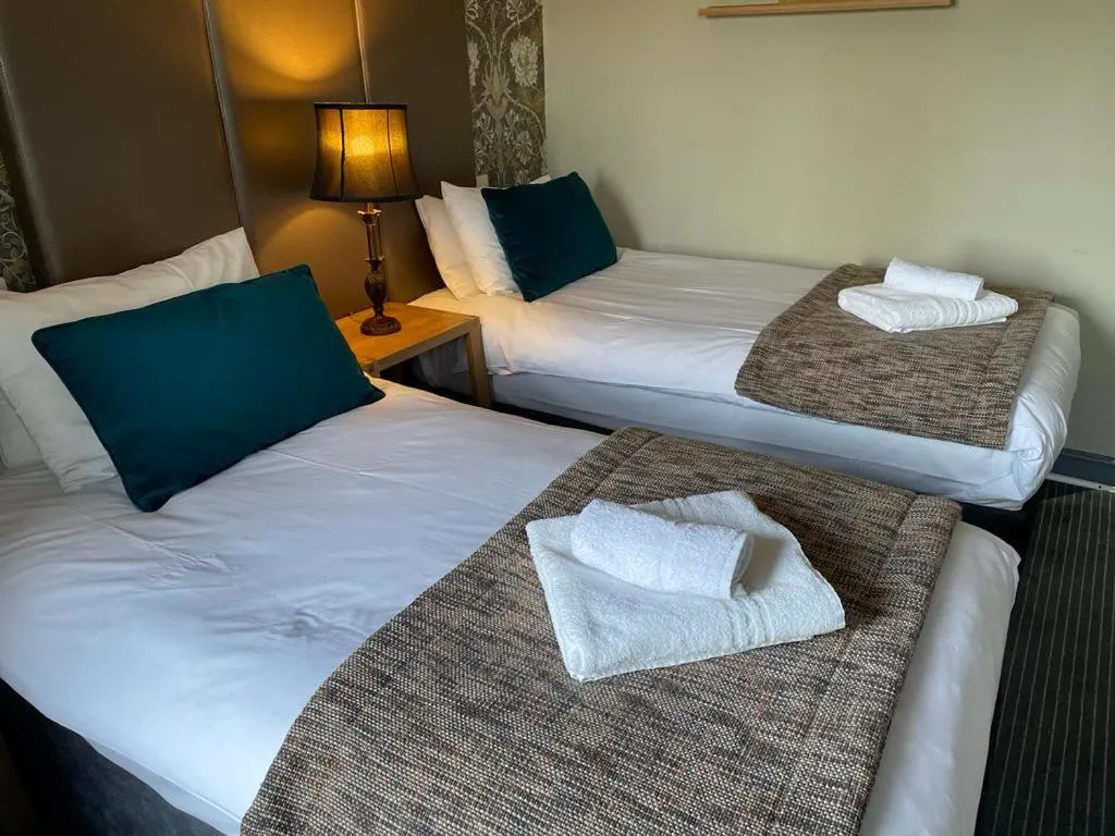 Bed in The New Hobbit Hotel Rooms