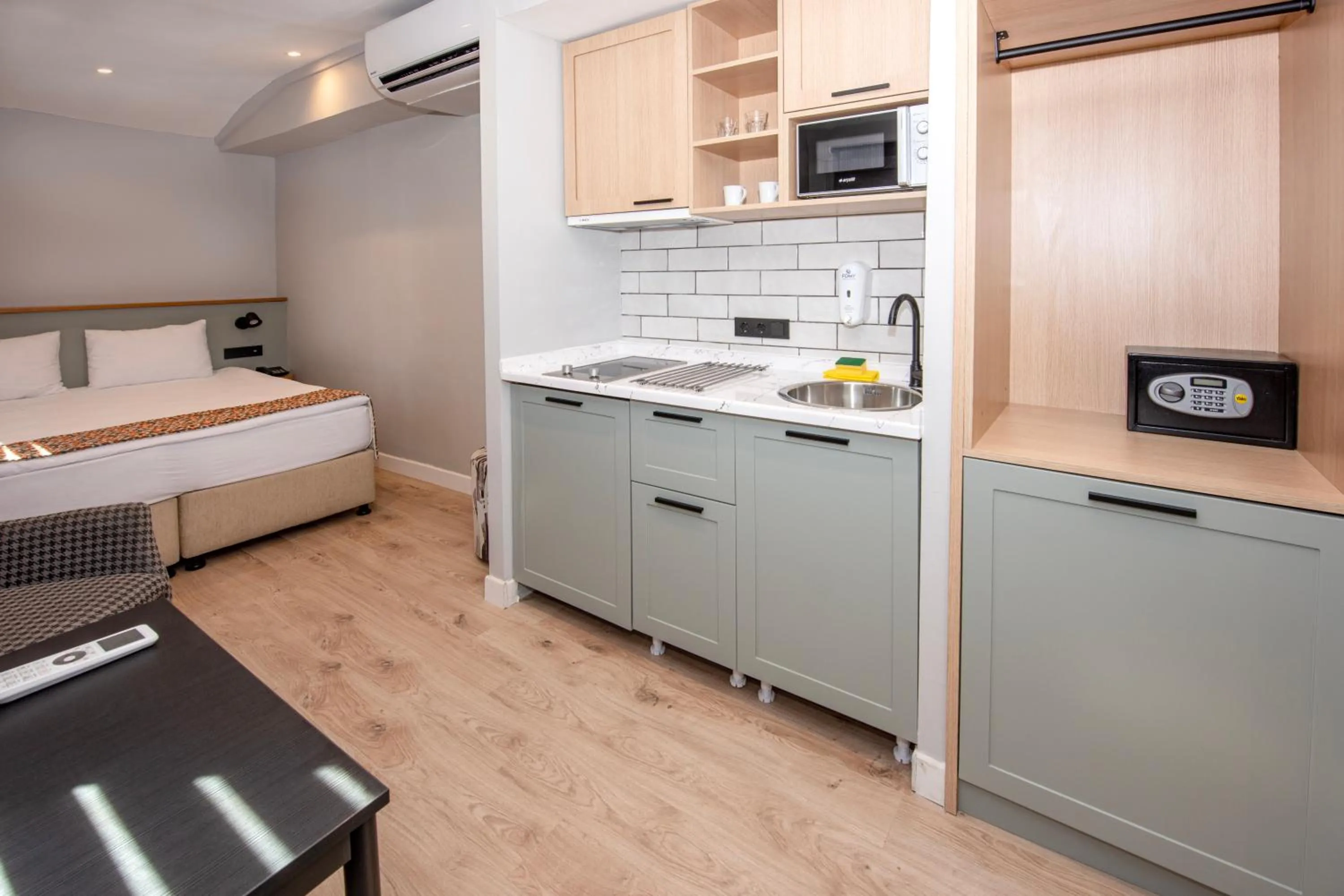 air conditioner, Bed in BGuest Hotel & Residence