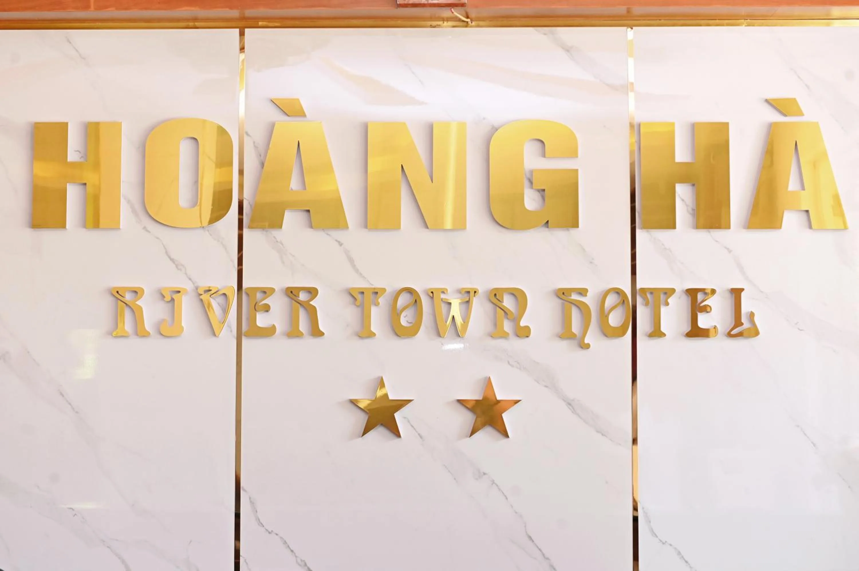 Property logo or sign in Khách sạn Hoàng Hà River Town