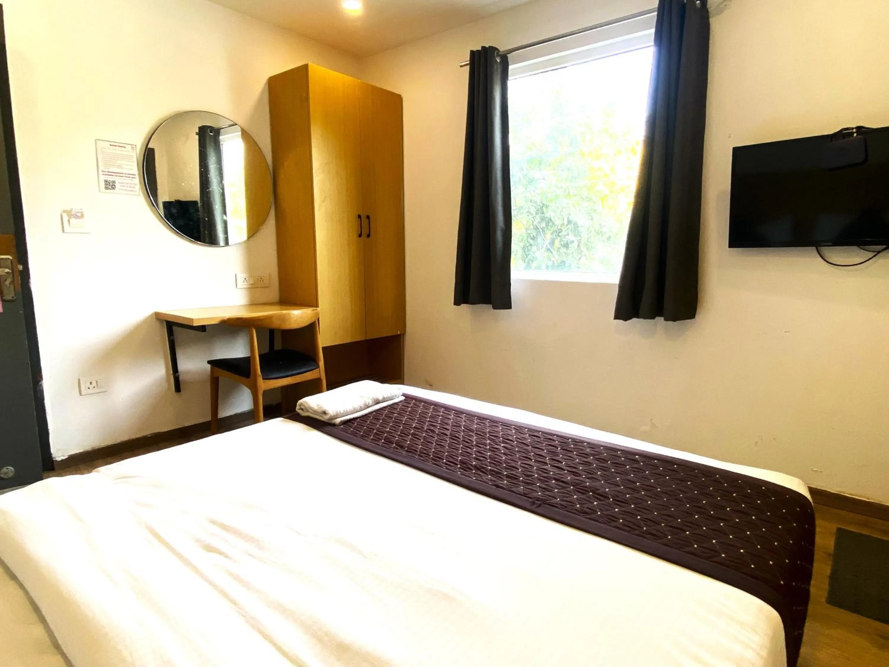 Communal lounge/ TV room, Bed in Qotel Comfort IP Residency East Delhi Preet Vihar