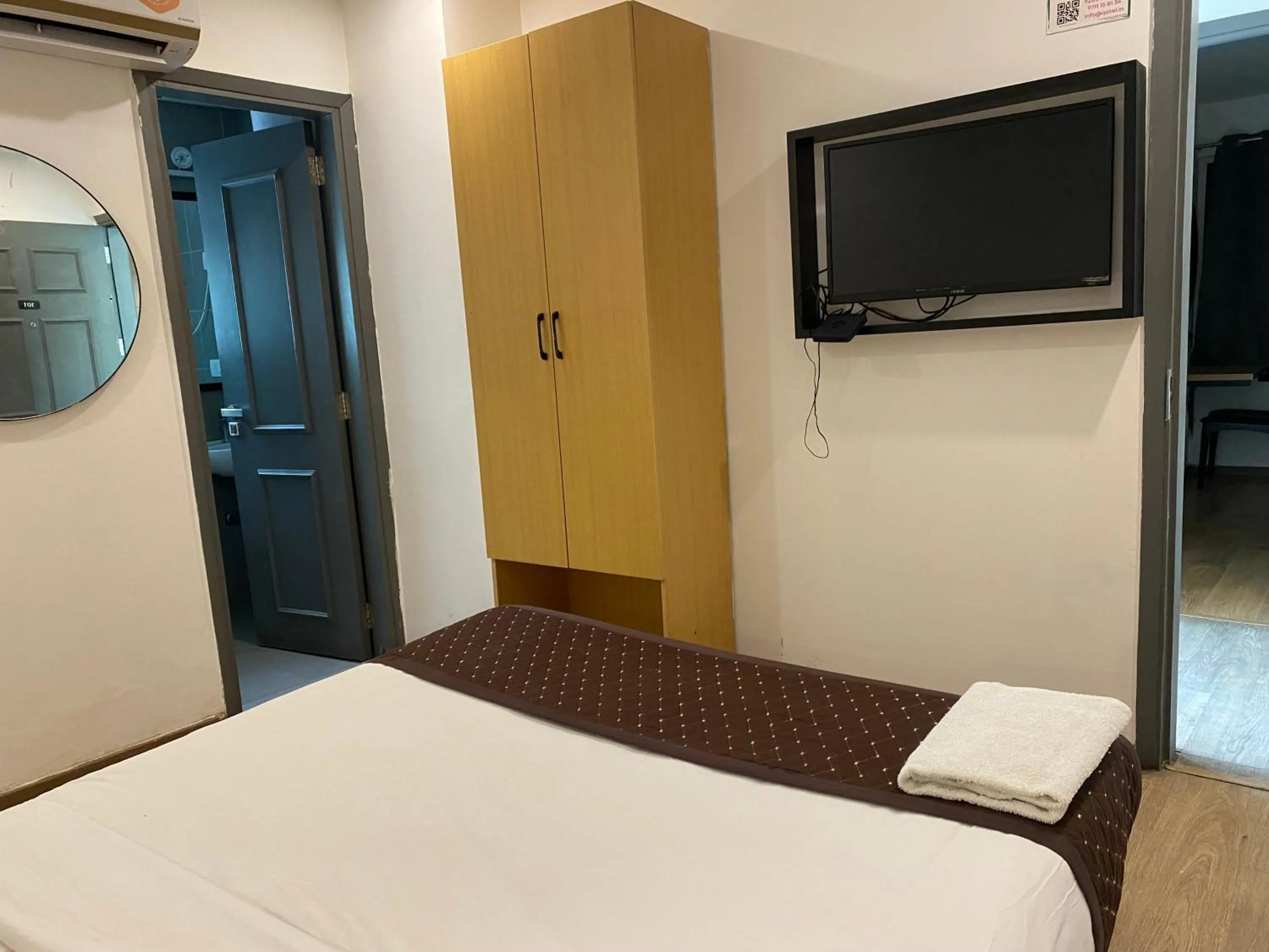 Communal lounge/ TV room, Bed in Qotel Comfort IP Residency East Delhi Preet Vihar