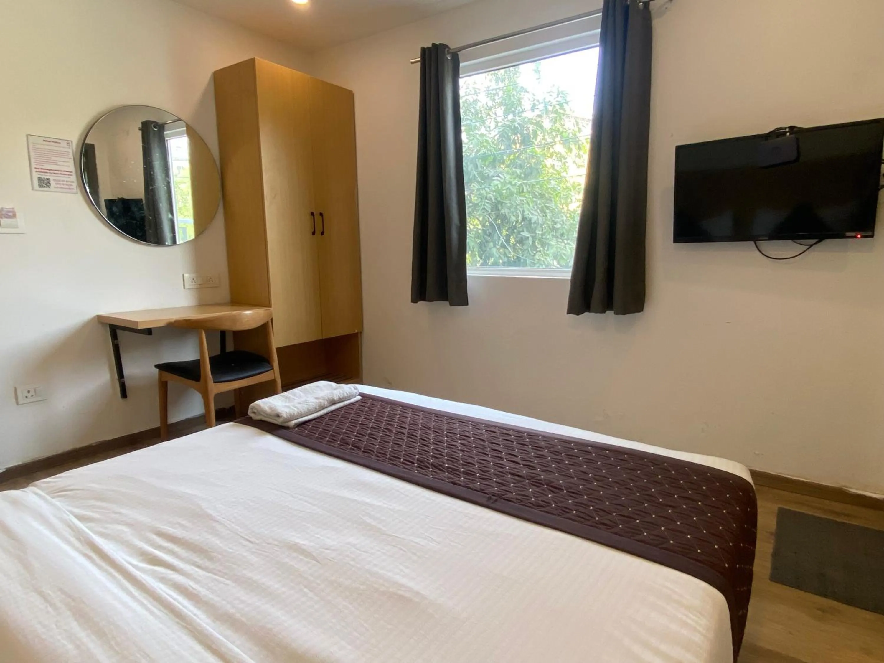 Communal lounge/ TV room, Bed in Qotel Comfort IP Residency East Delhi Preet Vihar