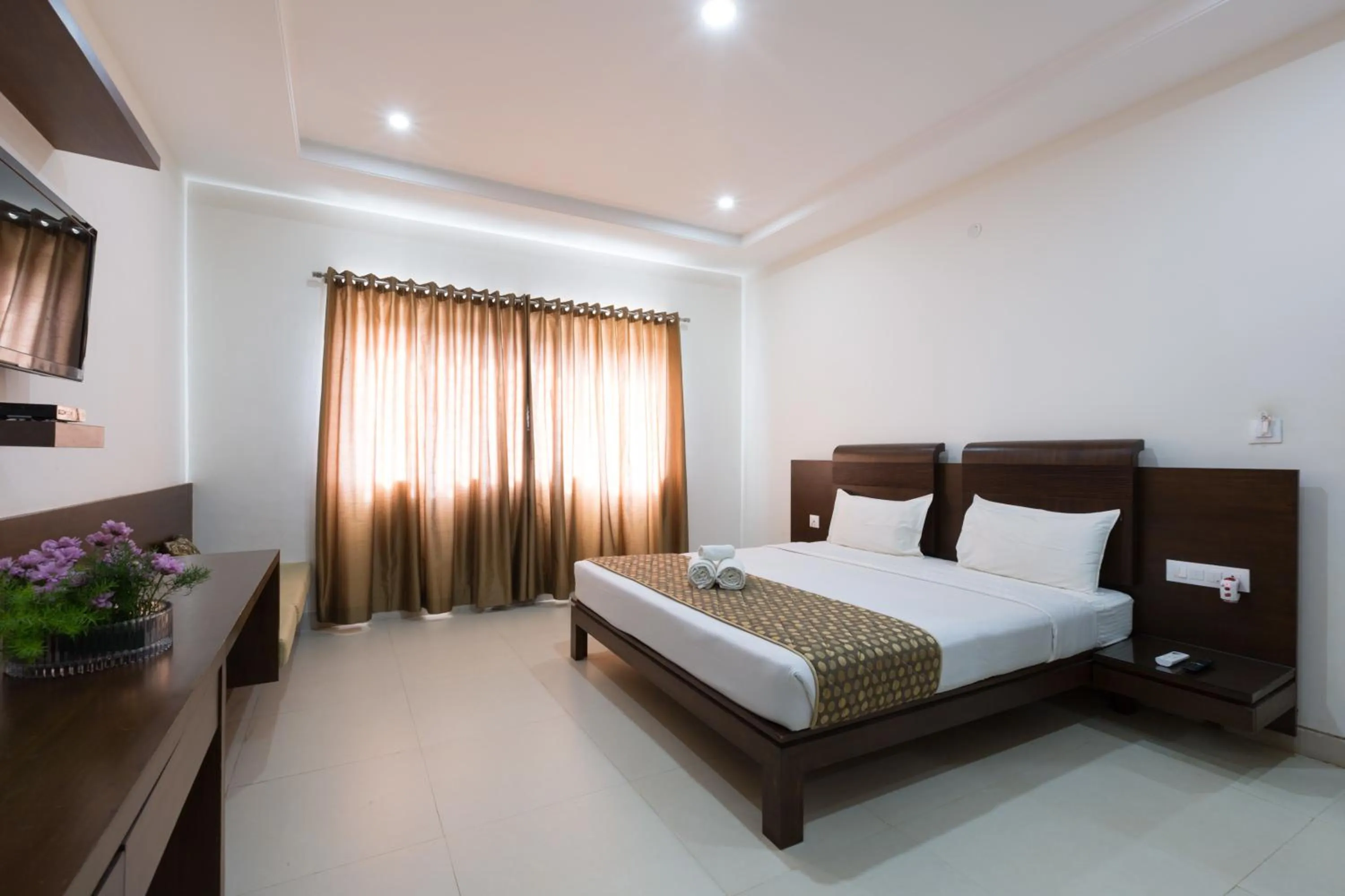 Photo of the whole room, Bed in Sanctum Suites BEL Road Bangalore