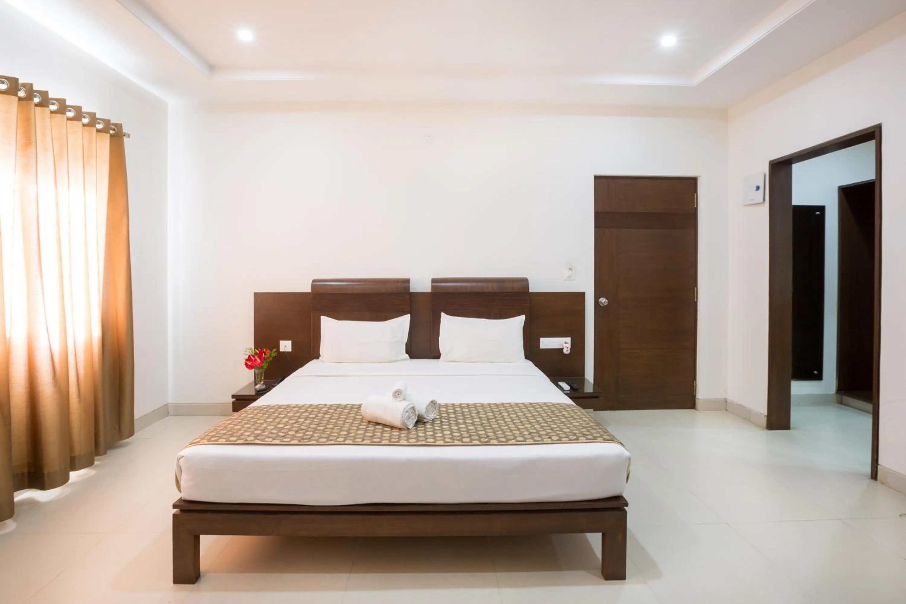 Photo of the whole room, Bed in Sanctum Suites BEL Road Bangalore