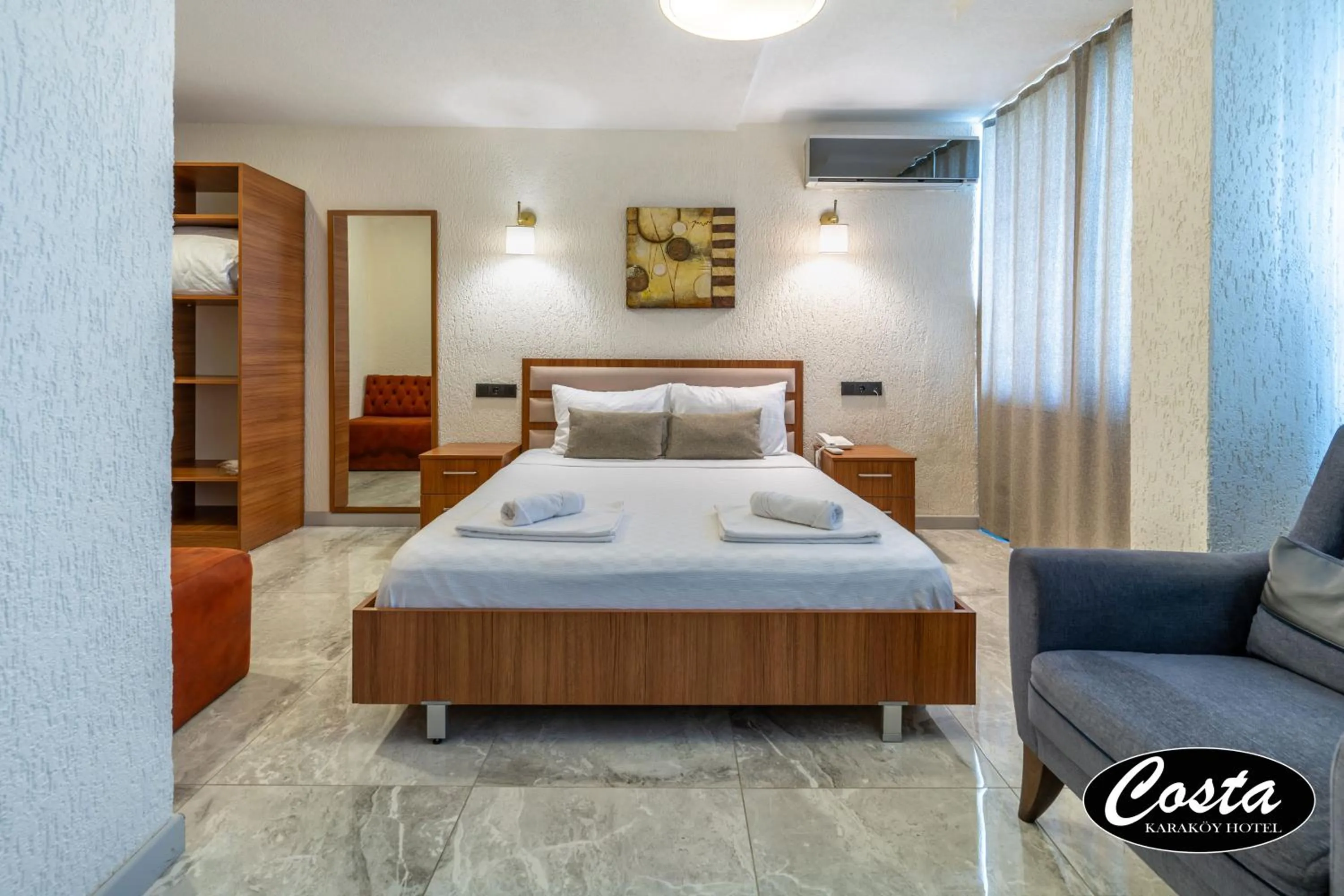 Bed in Costa Karakoy Hotel