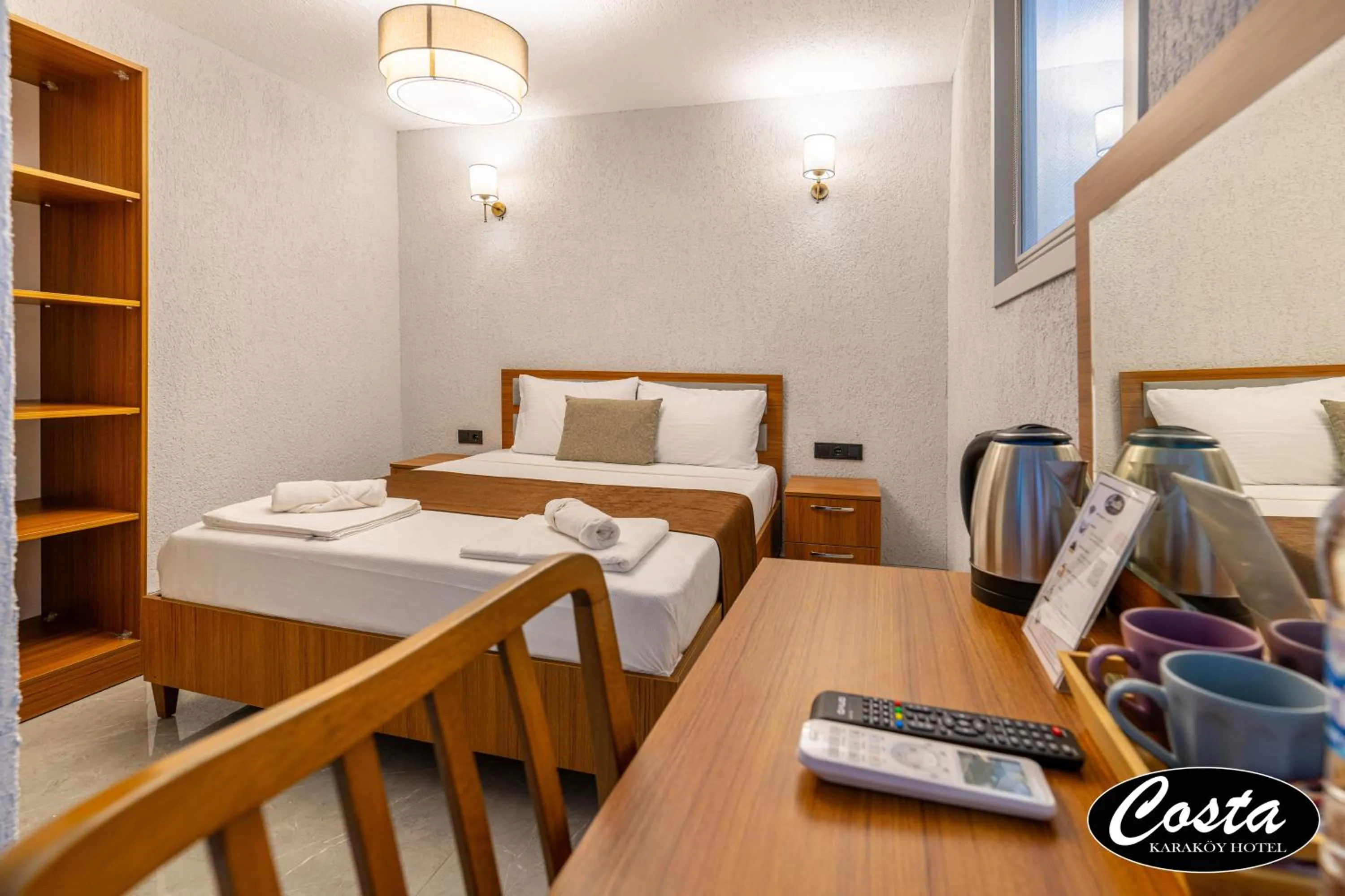 Bed in Costa Karakoy Hotel