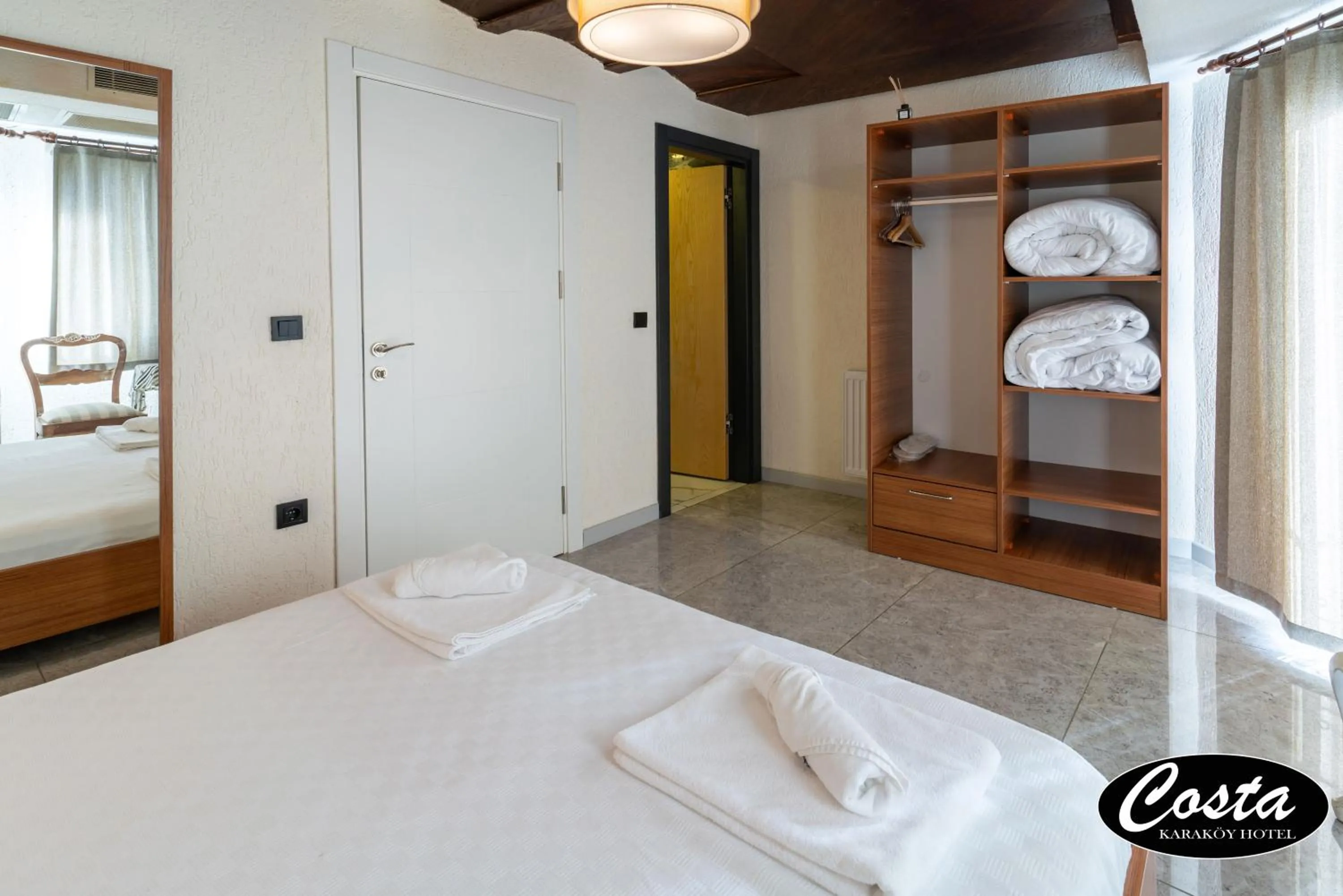 Bed in Costa Karakoy Hotel