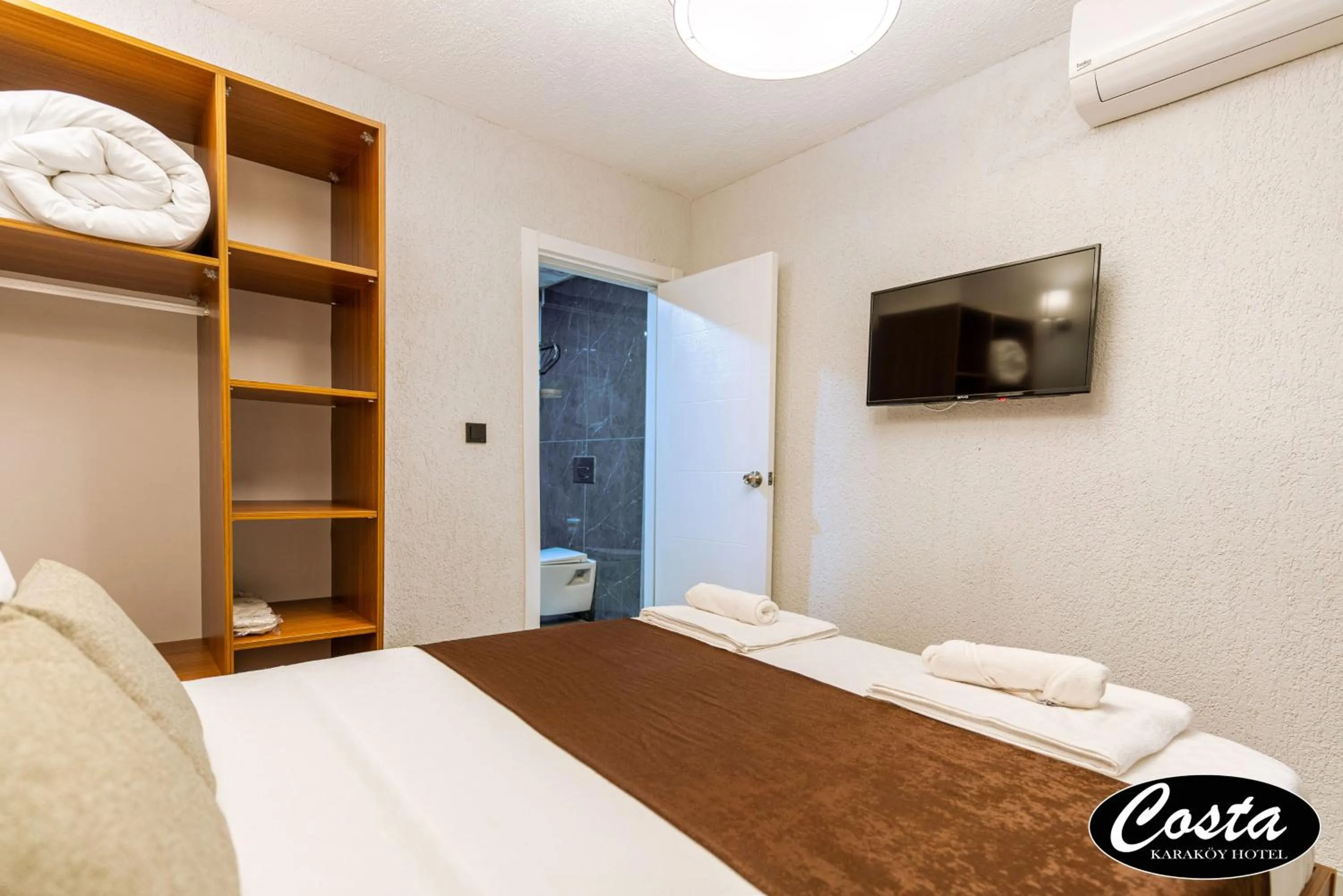 Bed in Costa Karakoy Hotel