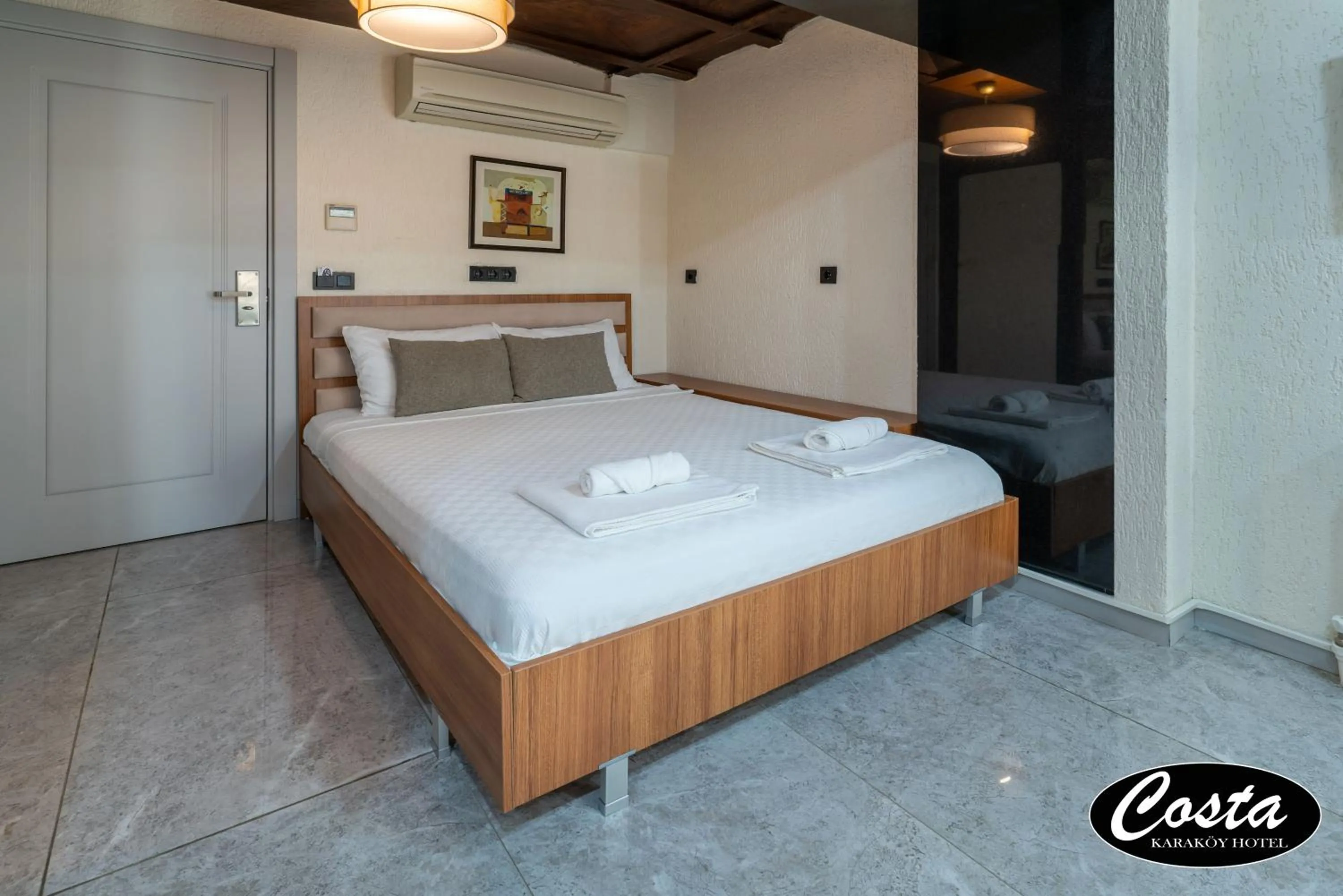 Bed in Costa Karakoy Hotel