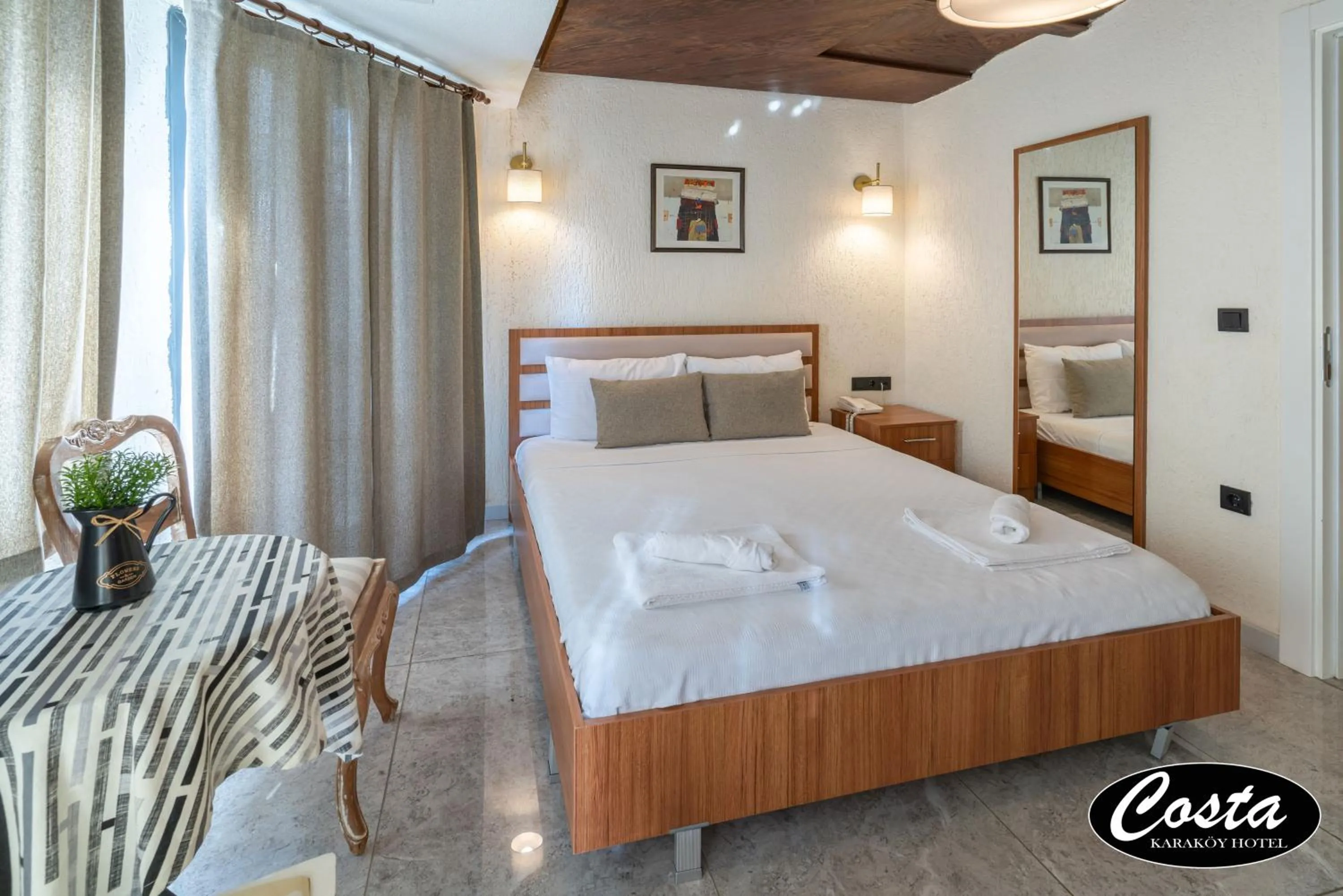 Bed in Costa Karakoy Hotel