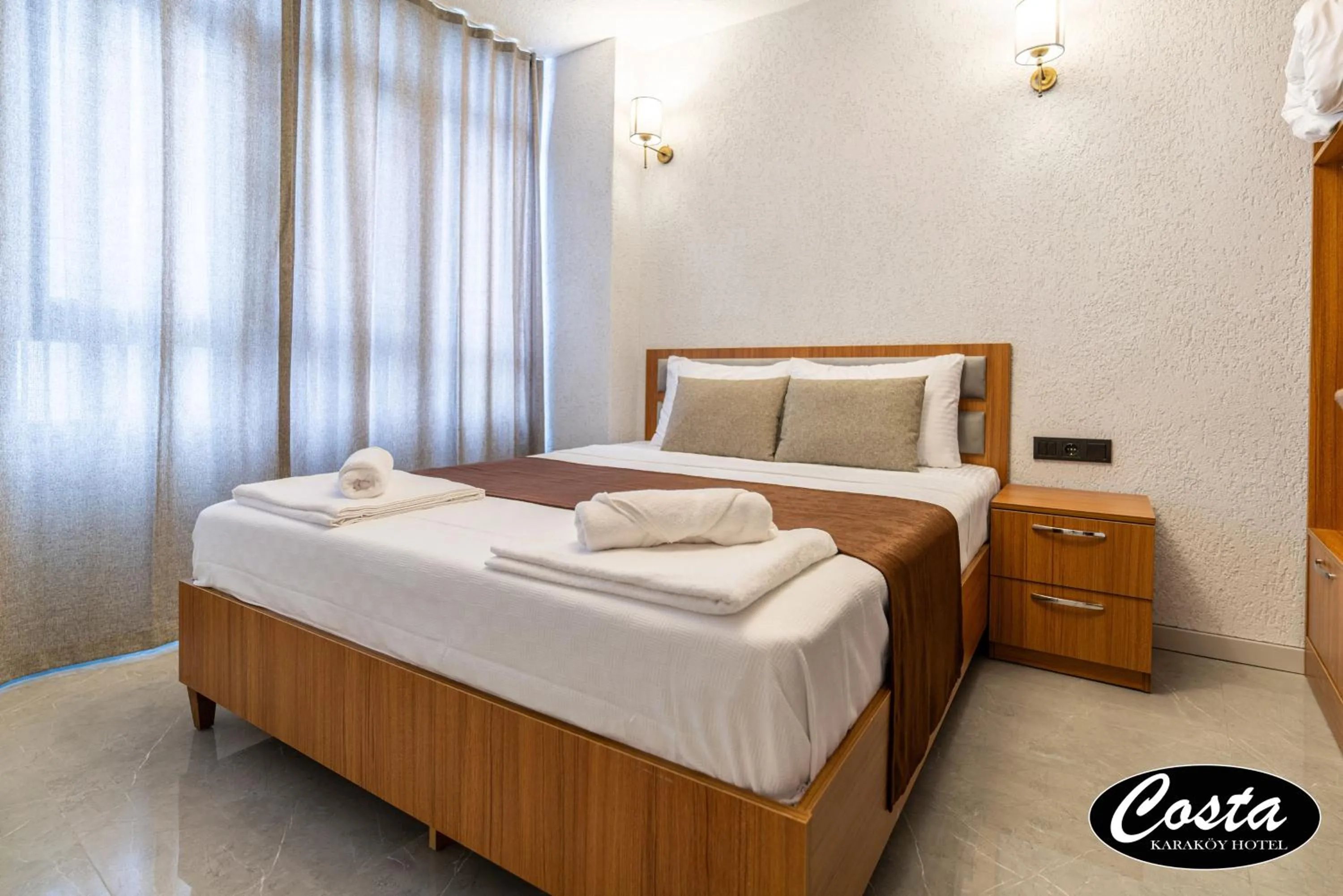 Bed in Costa Karakoy Hotel