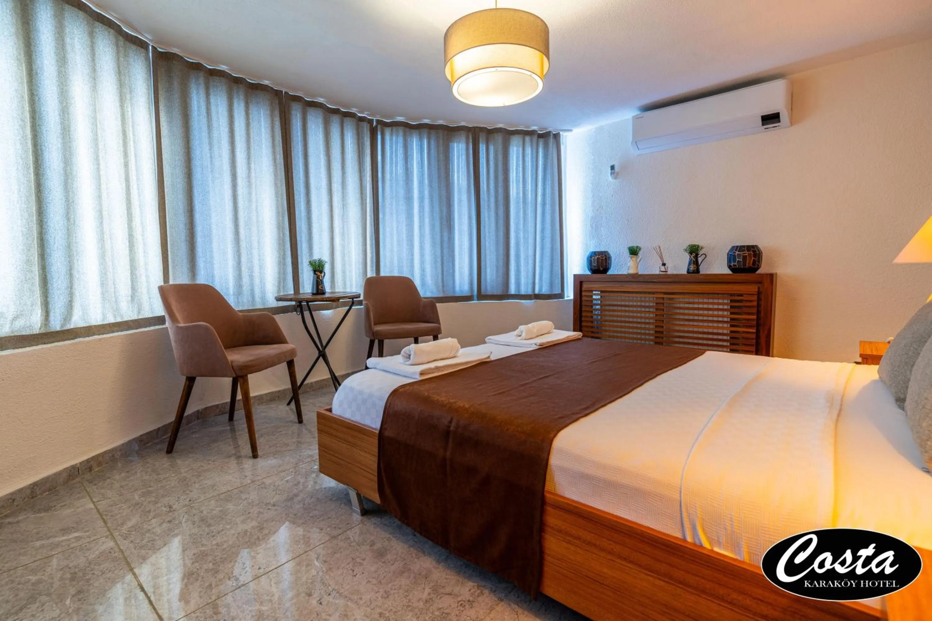 Bed in Costa Karakoy Hotel