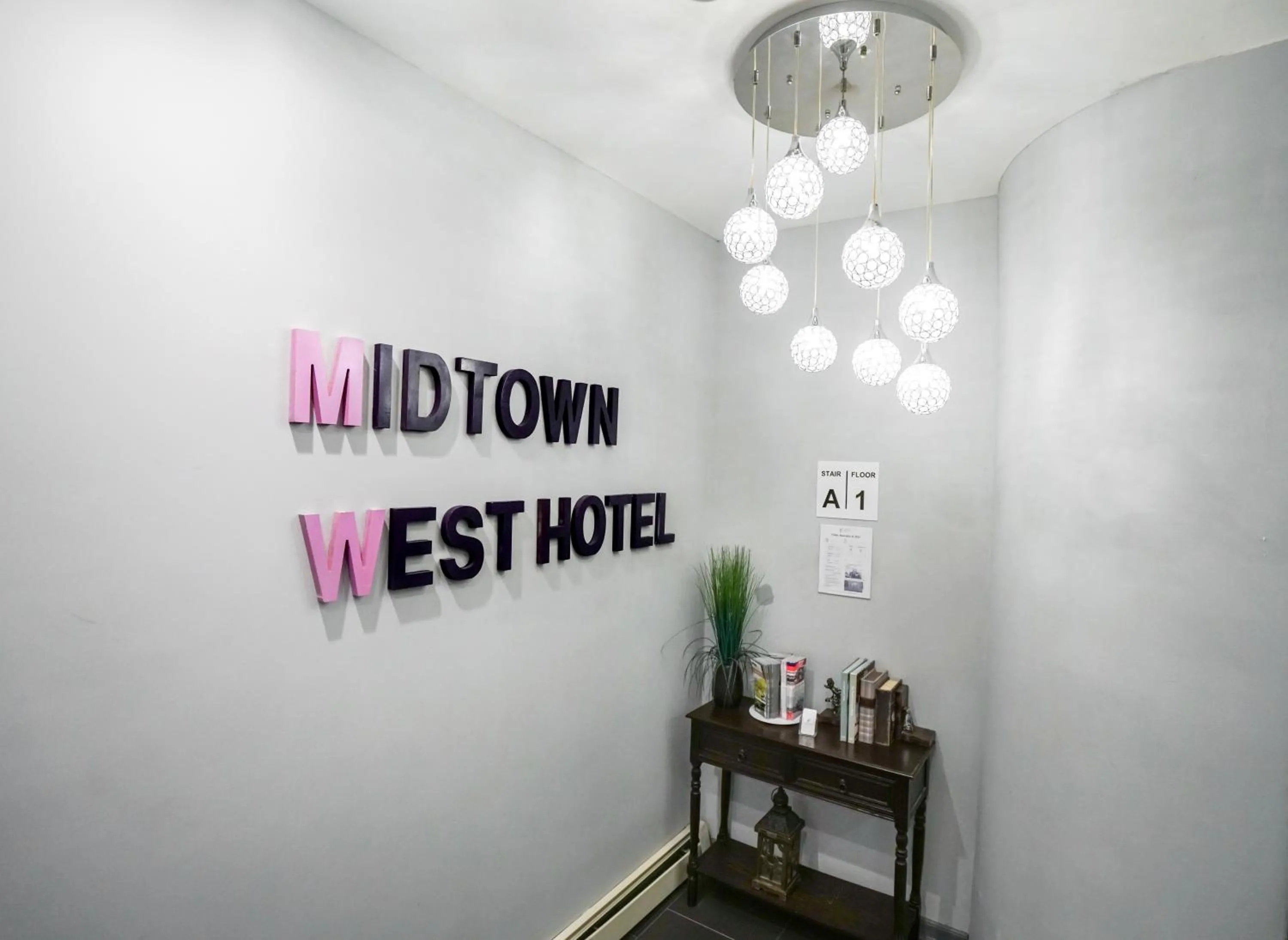 Property logo or sign in Midtown West Hotel