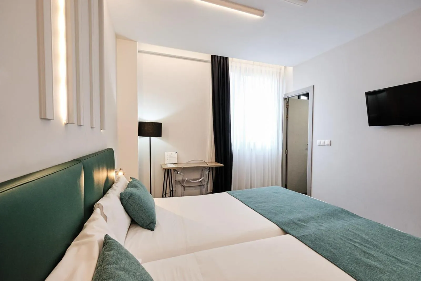 Photo of the whole room, Bed in Hotel Lux Santiago