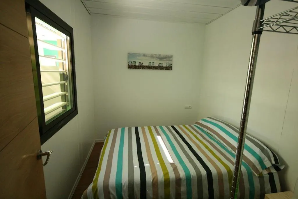 Text overlay, Bed in Camping Torrenostra