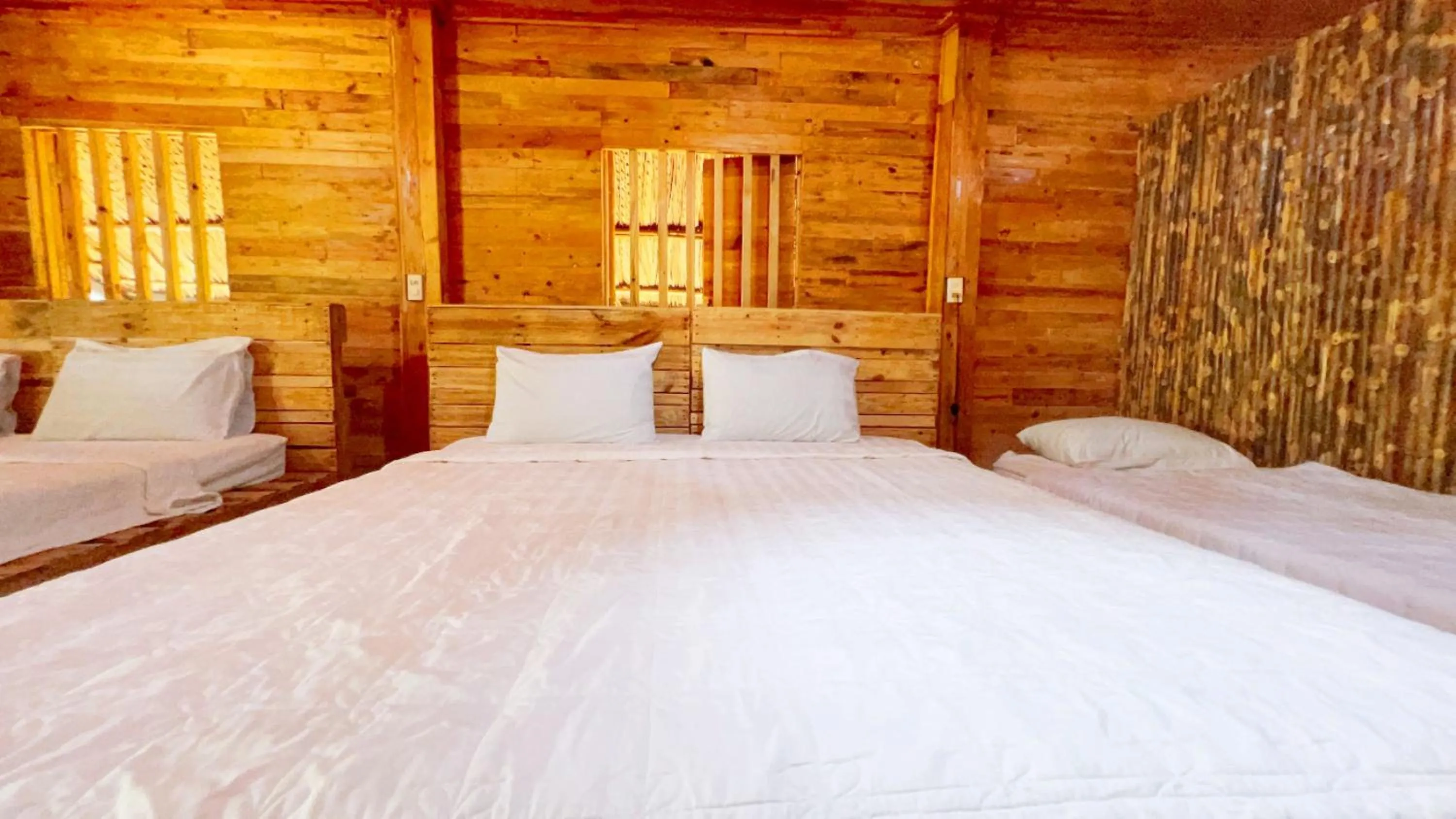 Bed in Me bungalow beach resort