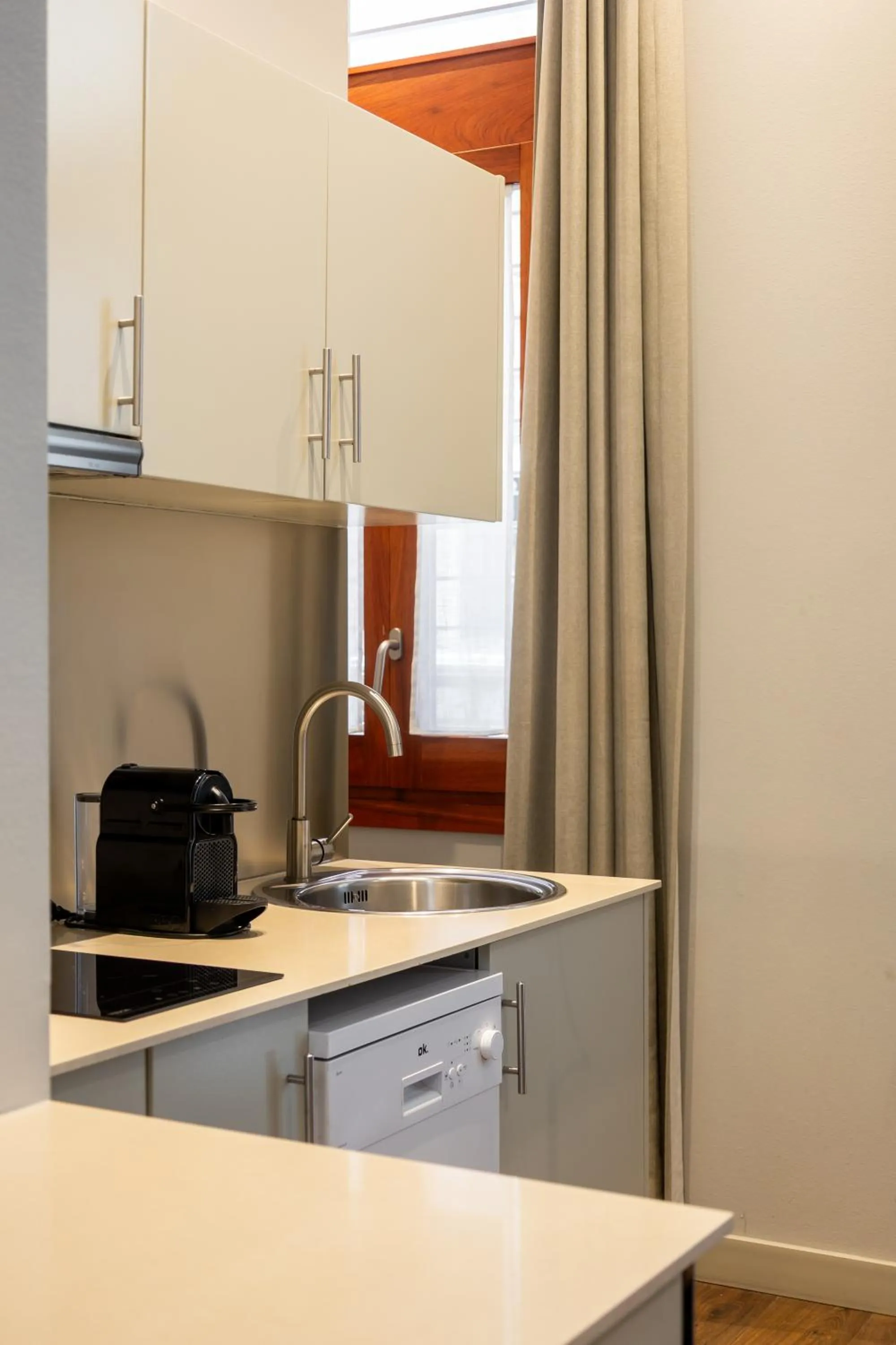Kitchen or kitchenette in Uma Suites Barceloneta Beach