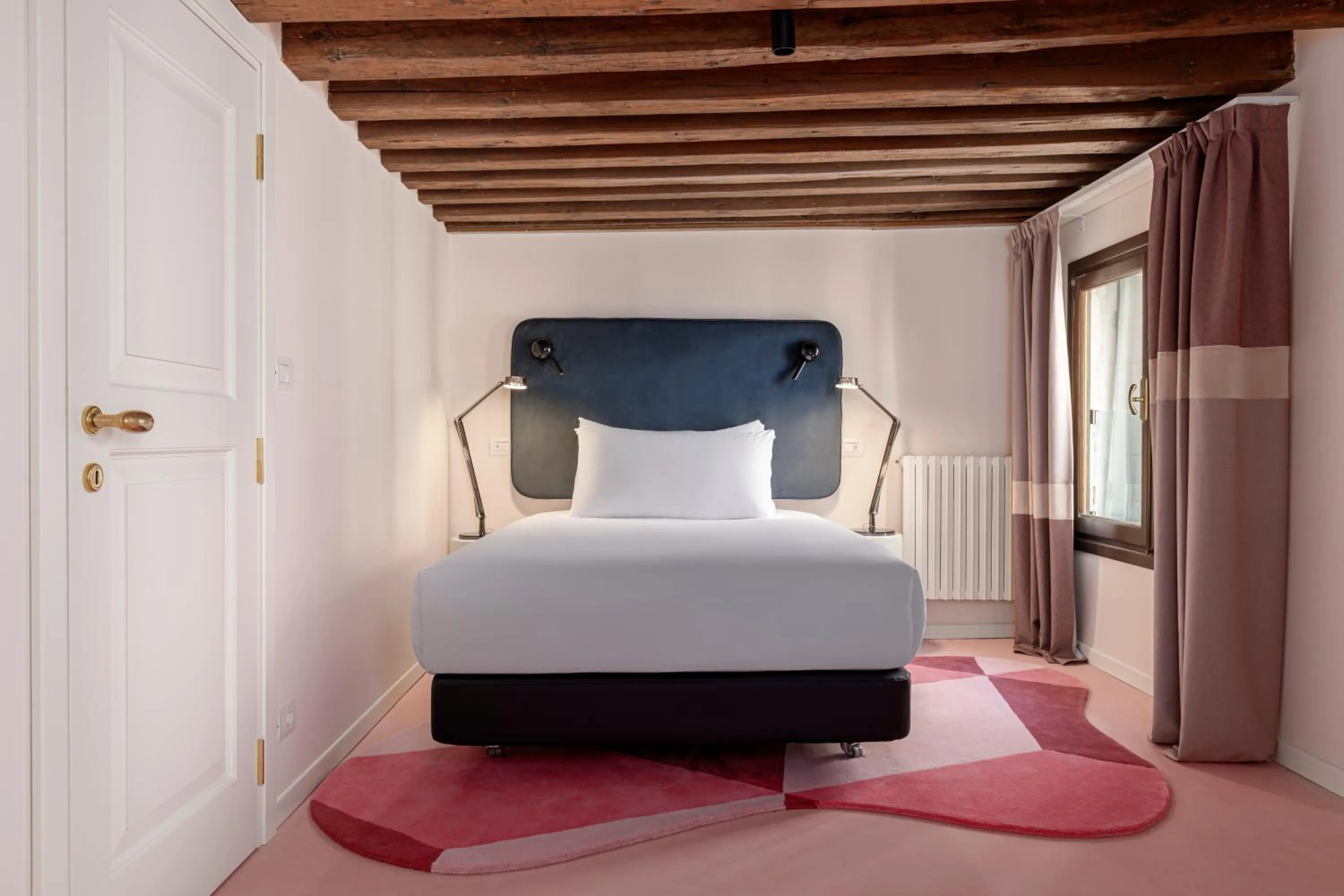 Bed in Palazzo Dei Fiori by Room Mate