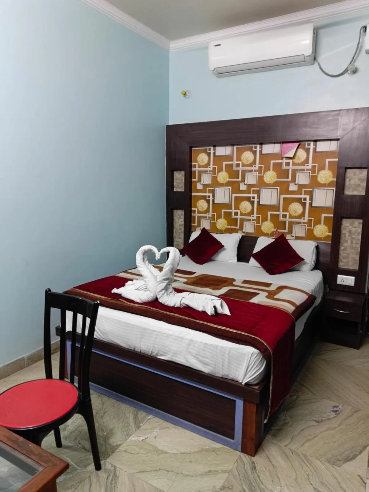 Bed in Hotel Nirmala Inn