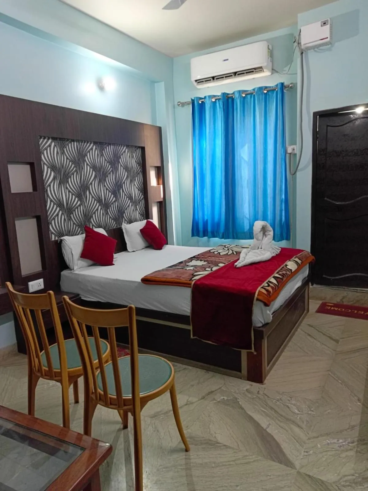Bed in Hotel Nirmala Inn