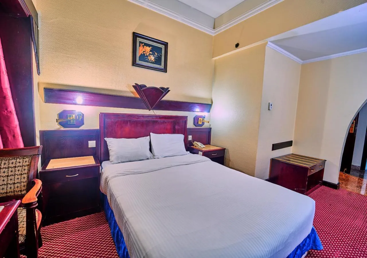 Bed in Claridge Hotel Dubai