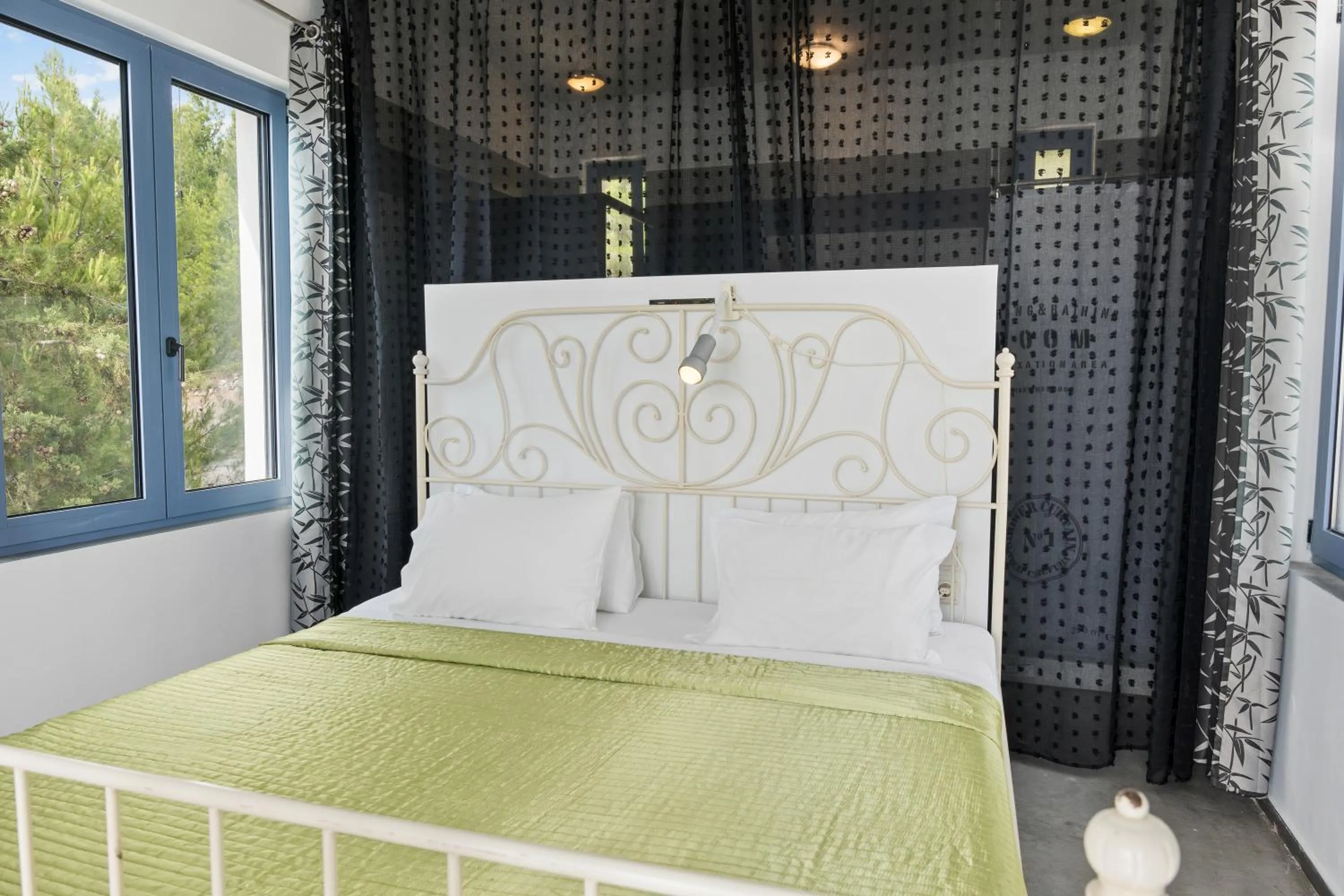 Bed in Serenity Boutique Suites