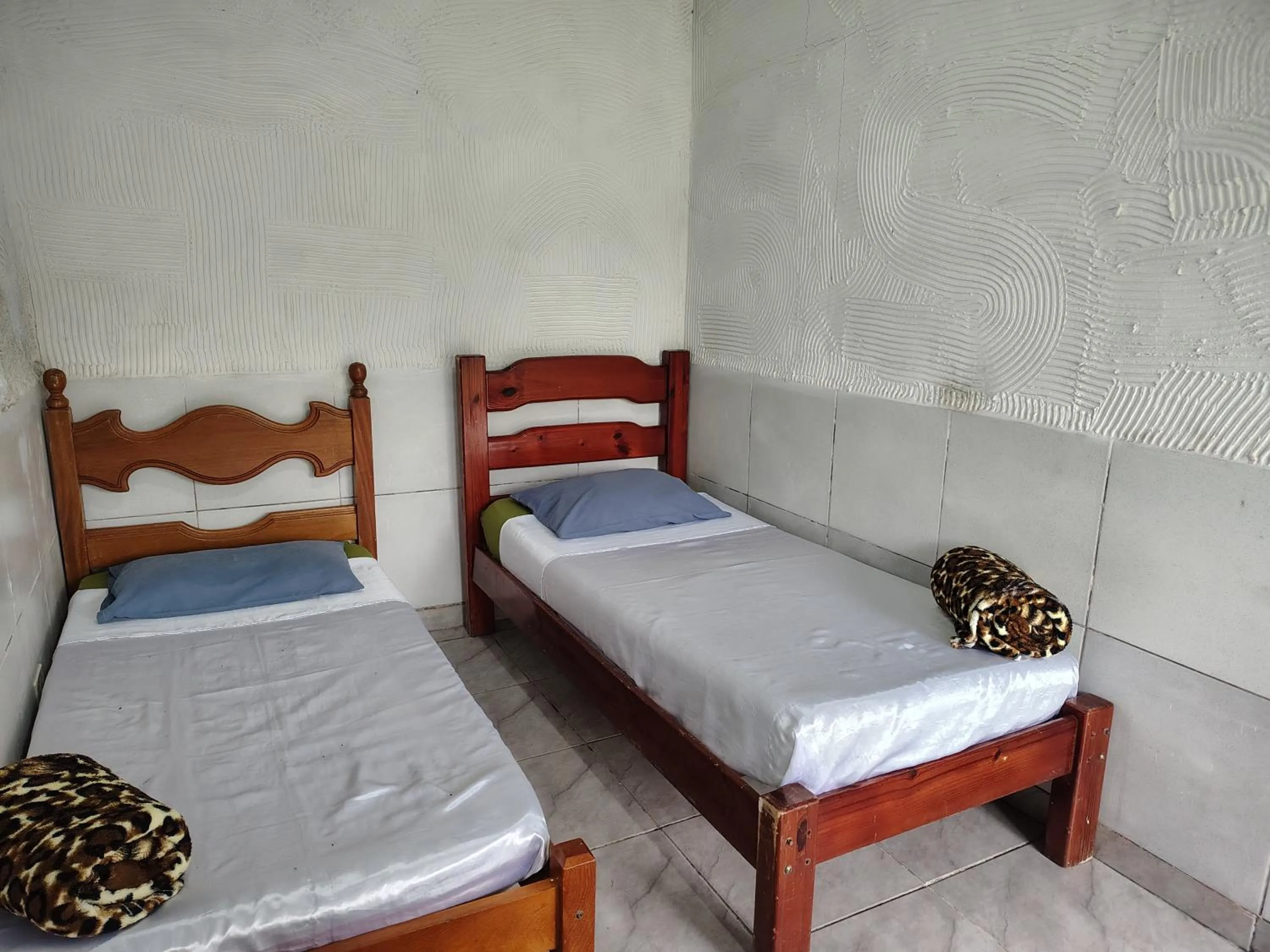 Bed in Pousada Lambaris Pereque Guarujá