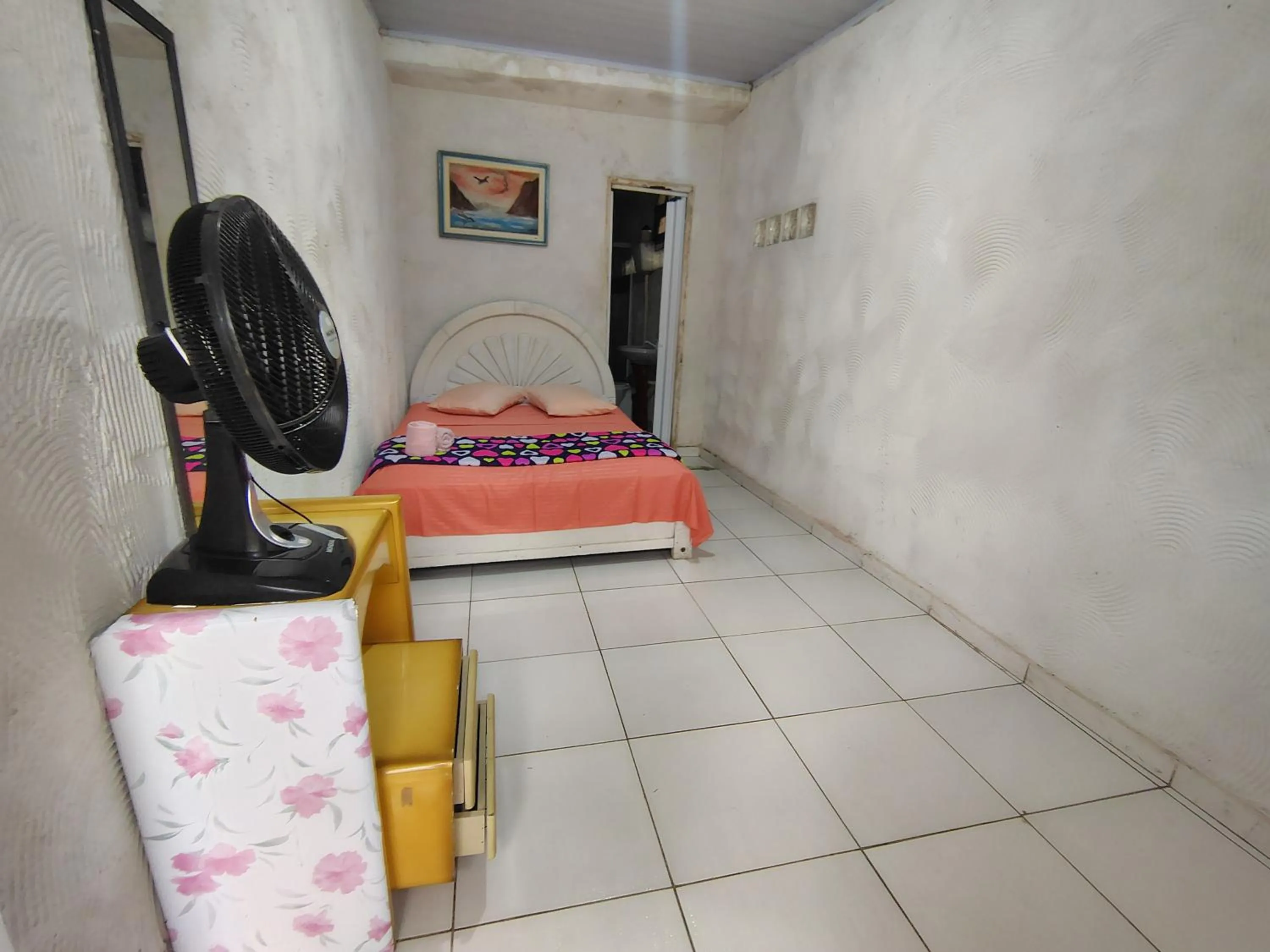 Bed in Pousada Lambaris Pereque Guarujá