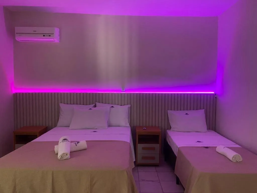 Bed in Pousada Sol da Enseada Guarujá Inn - Piscina Aquecida