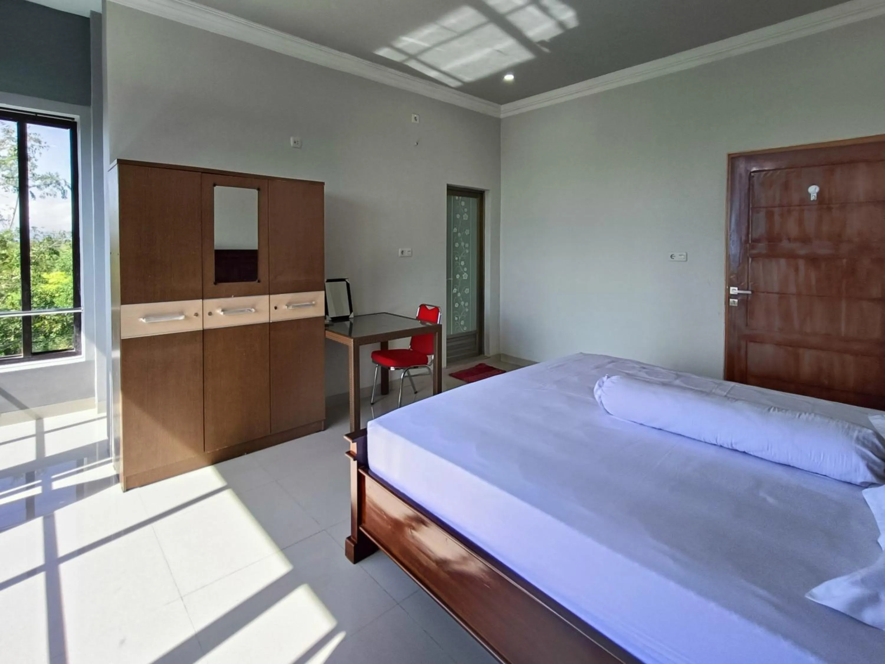 Bed in RedDoorz @ Green Homestay Syariah Baubau