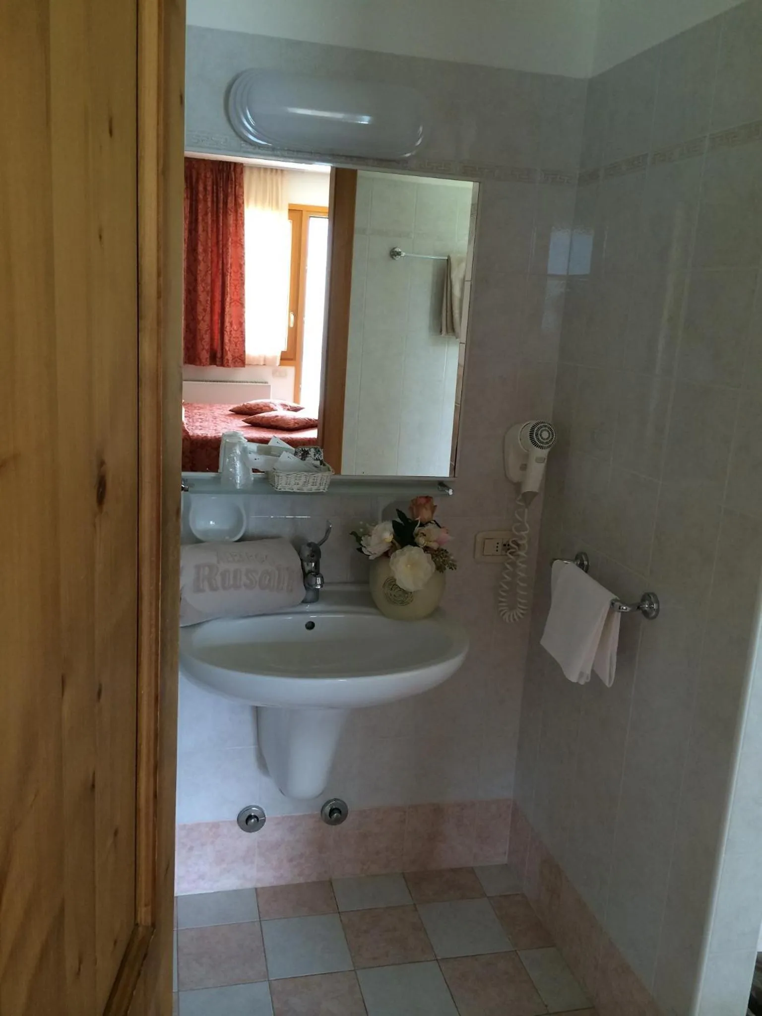 Bathroom in Albergo Rusall