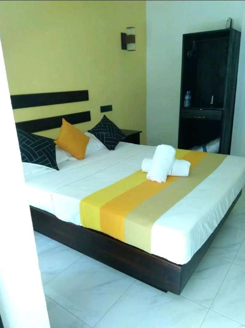 Bed in AMRON RESORT SIGIRIYA