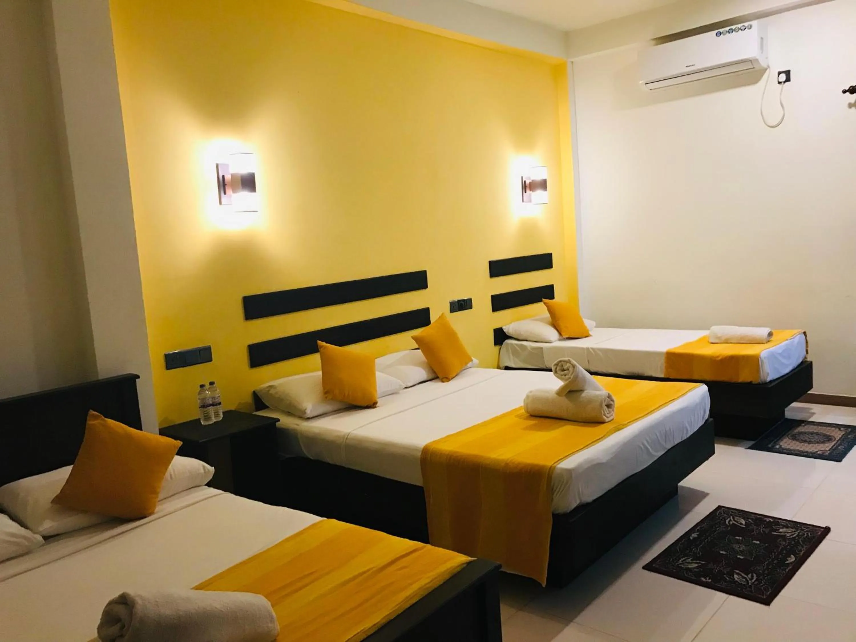 Bed in AMRON RESORT SIGIRIYA