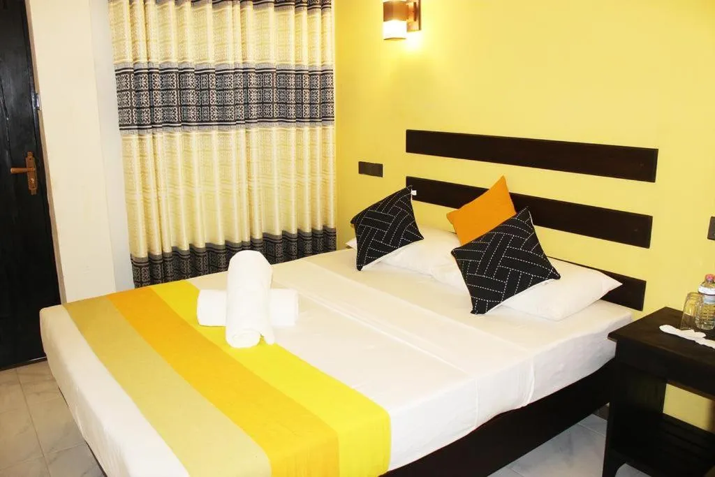 Bed in AMRON RESORT SIGIRIYA