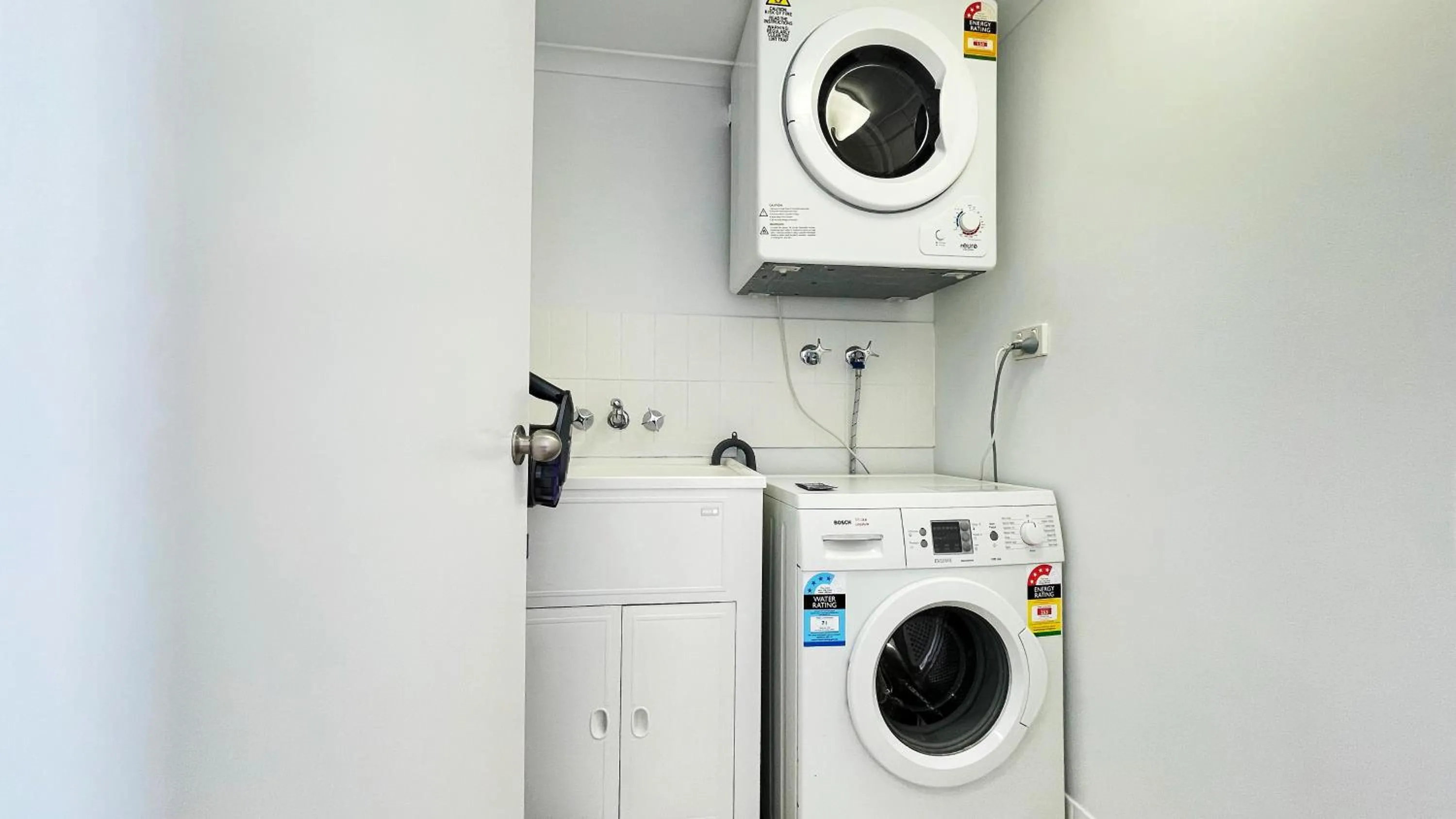 washing machine in Maroochydore Riverfront Apartment