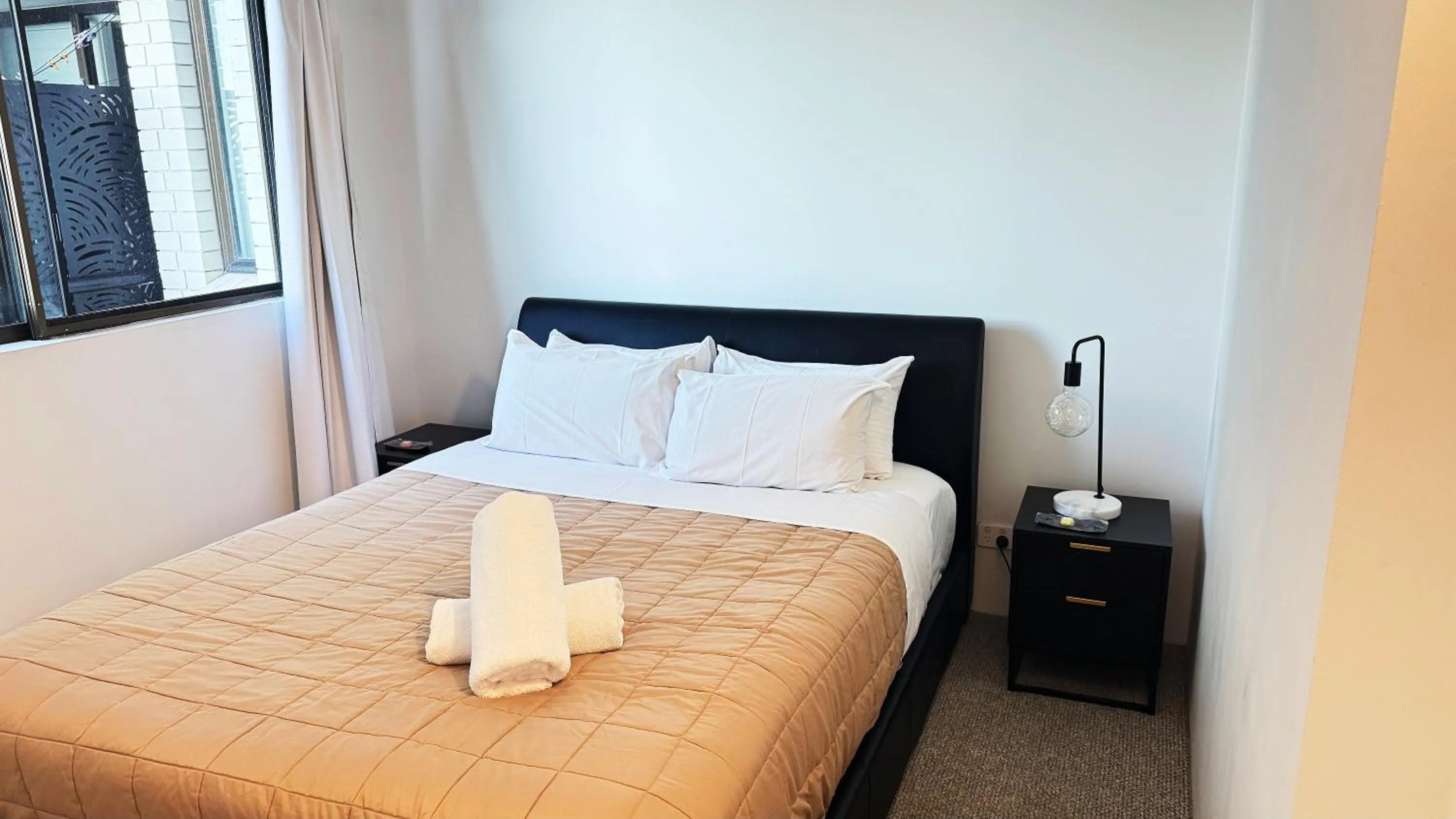 Bed in Maroochydore Riverfront Apartment