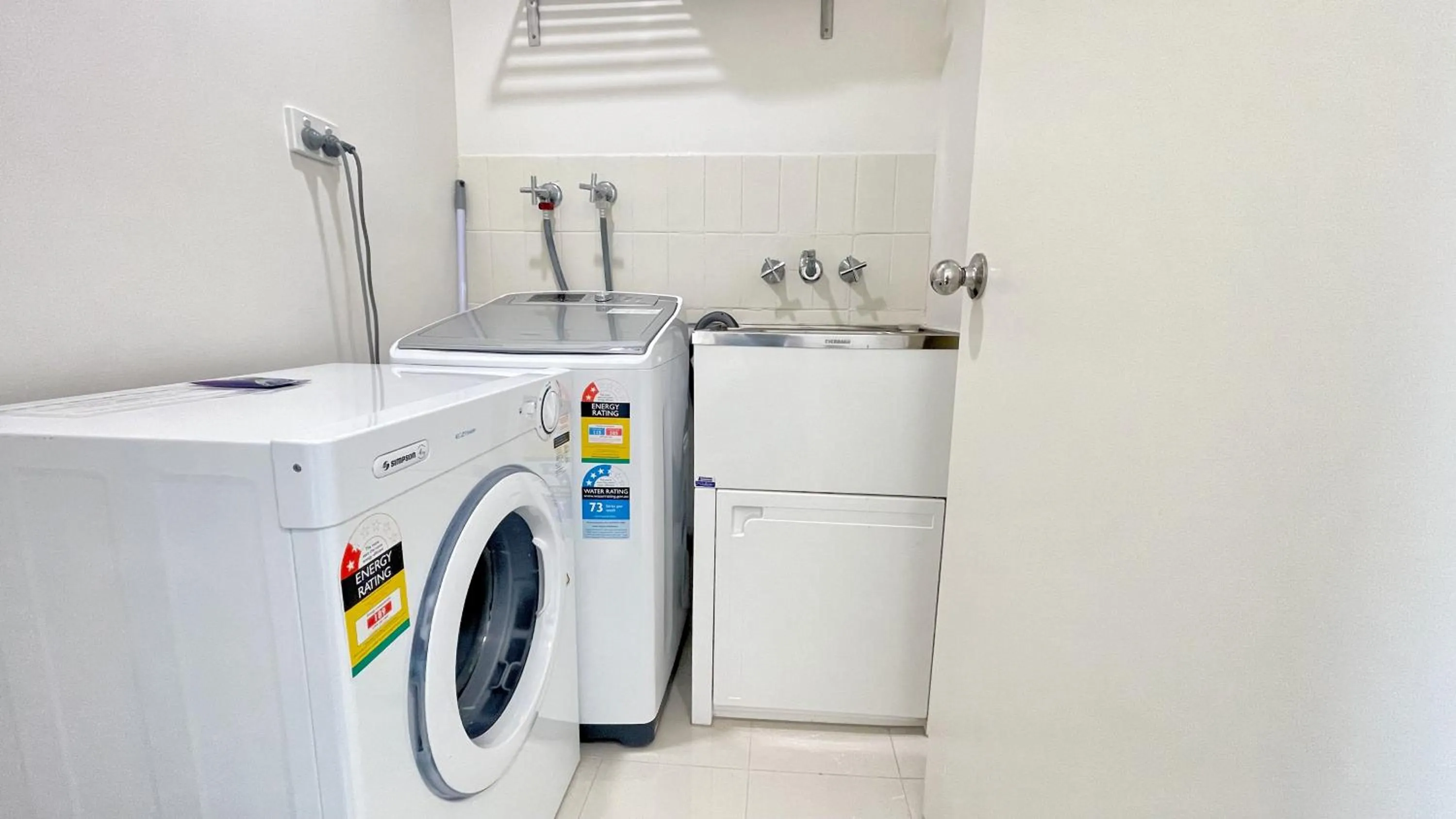 washing machine in Maroochydore Riverfront Apartment