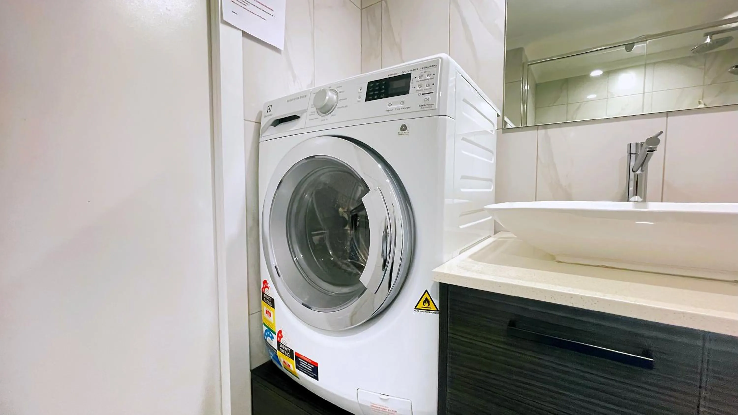 washing machine in Maroochydore Riverfront Apartment