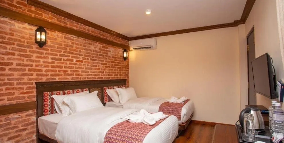 Bed in Pashupati Boutique Hotel & Spa