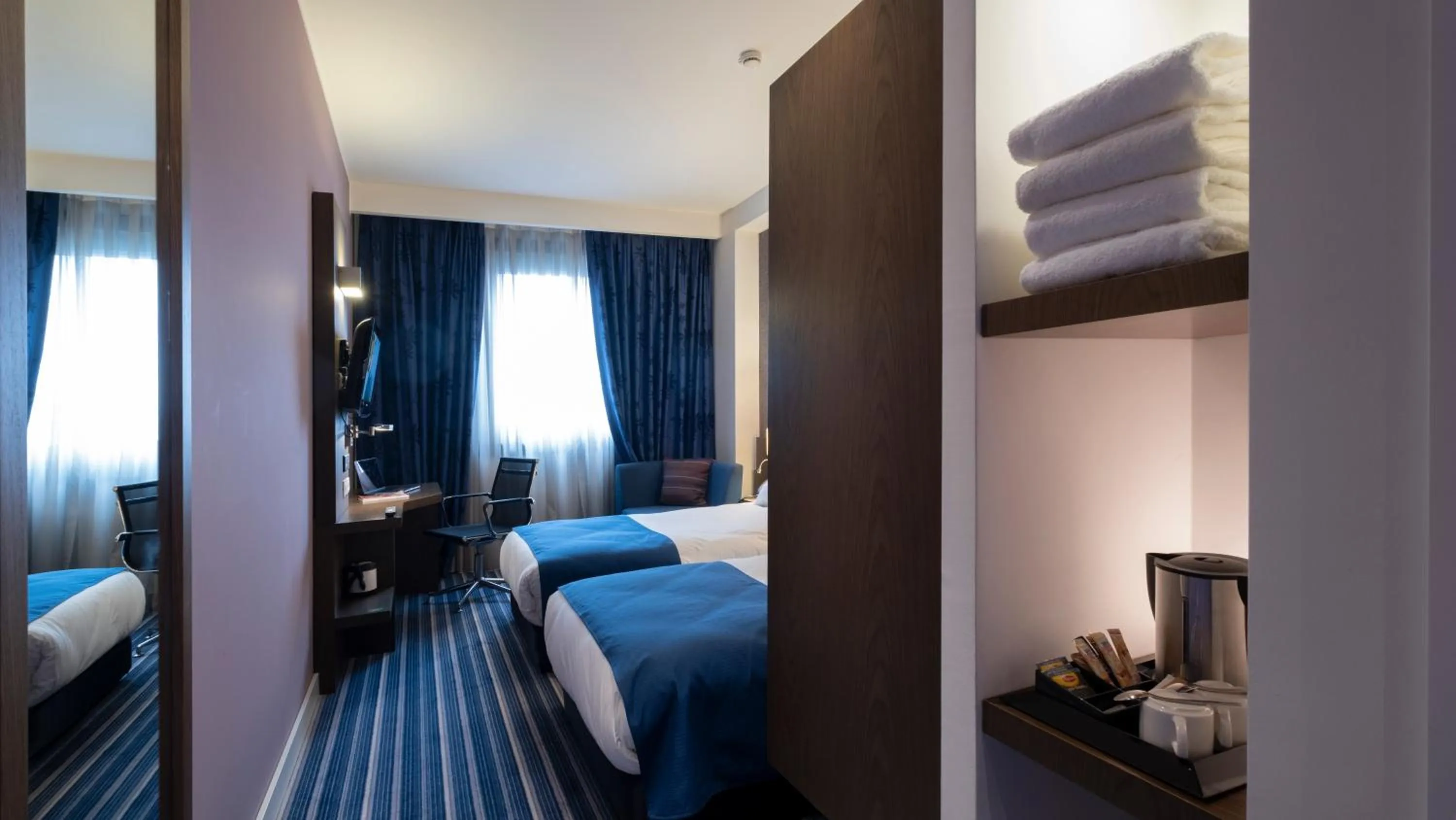 Bed in FEZ INN Hotel