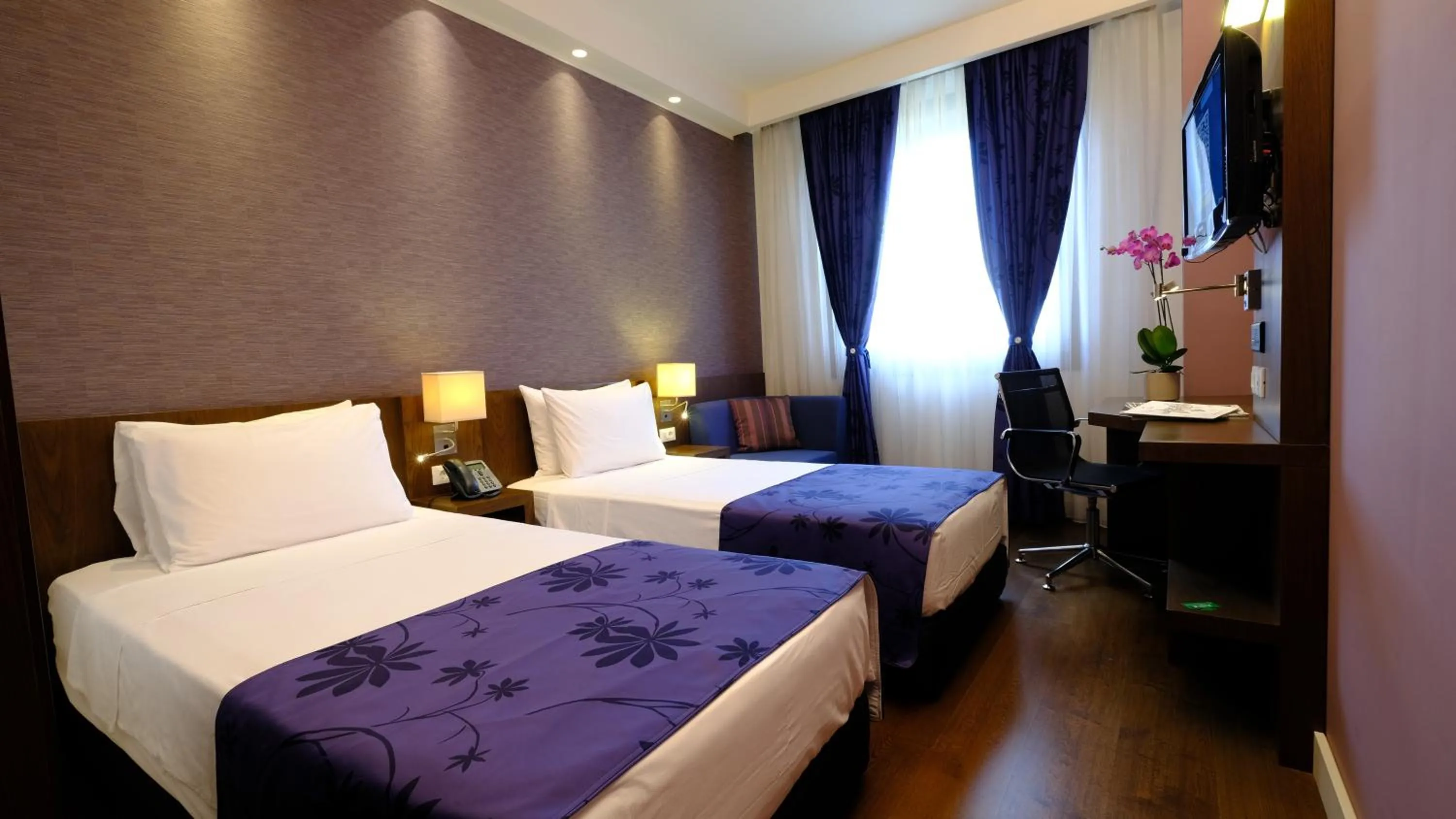 Bed in FEZ INN Hotel