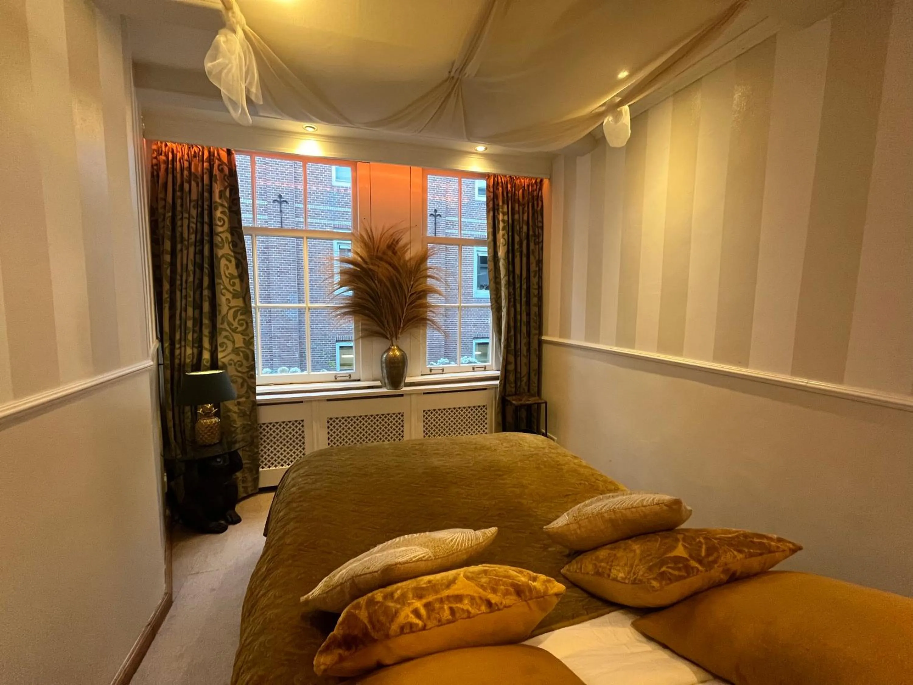 Bed in The Enlightened House Luxury Suites