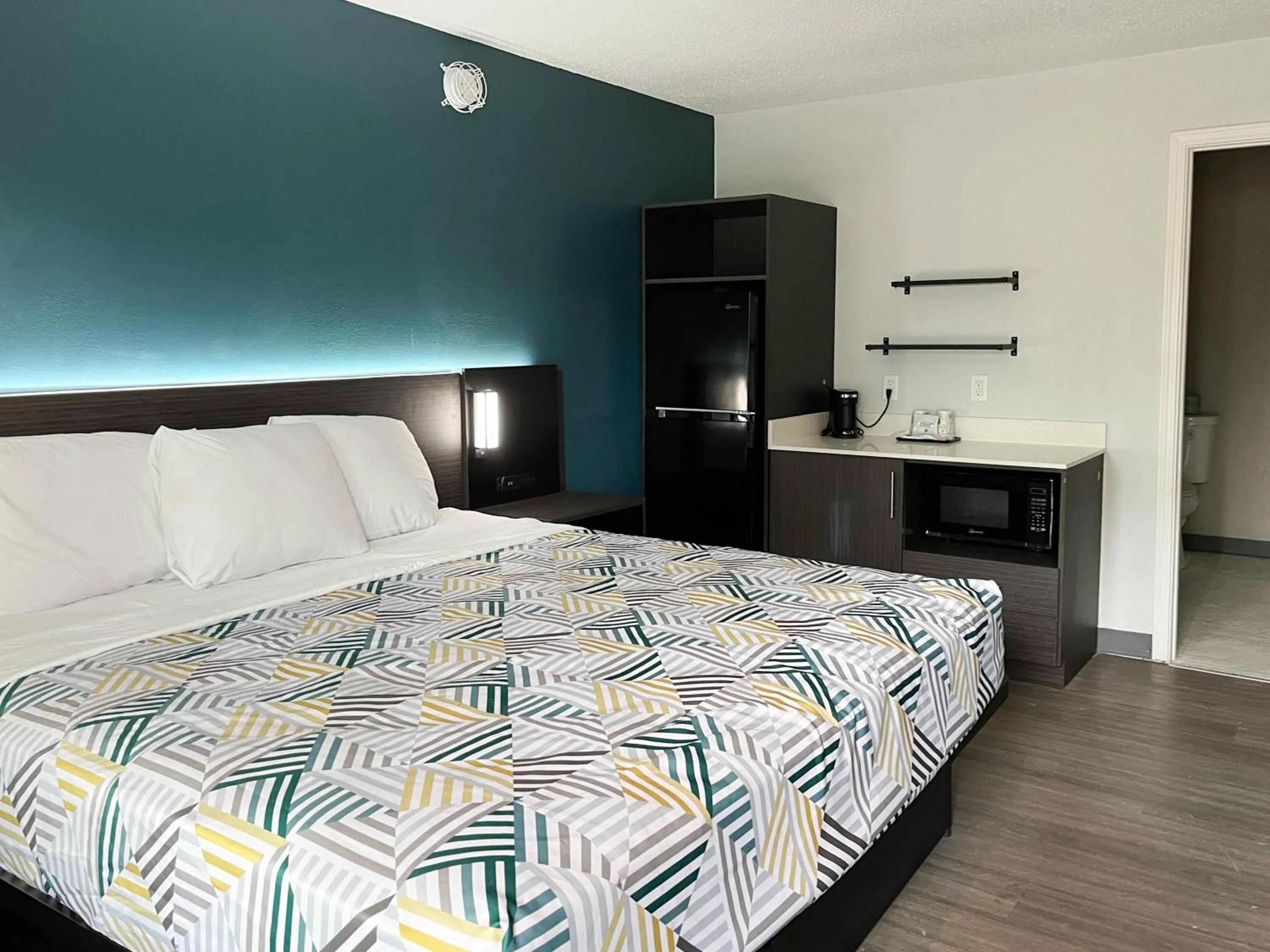 Kitchen or kitchenette, Bed in Studio 6 Suites - Lafayette, IN