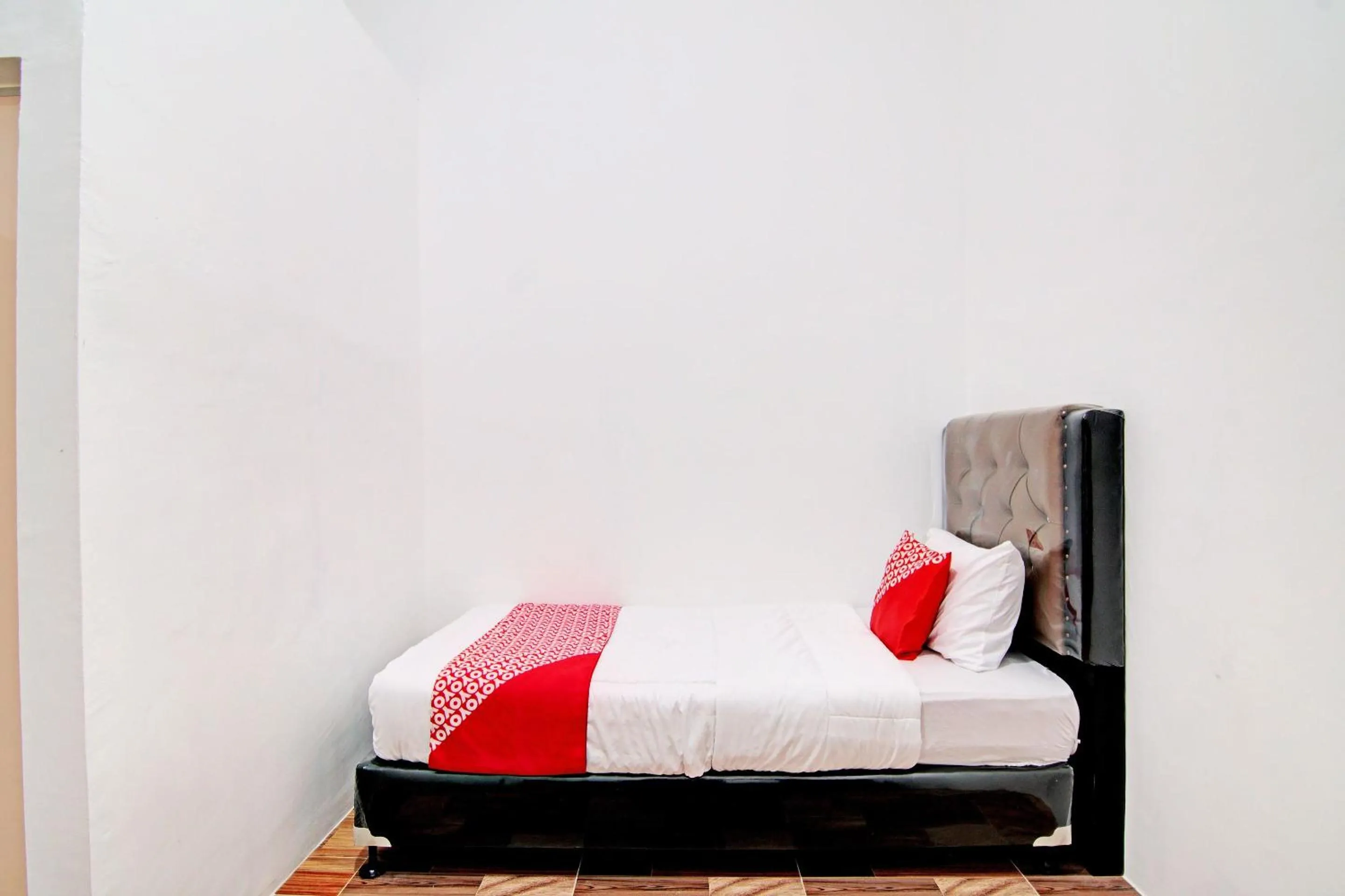 Bedroom in OYO 92946 Dekna Homestay Syariah